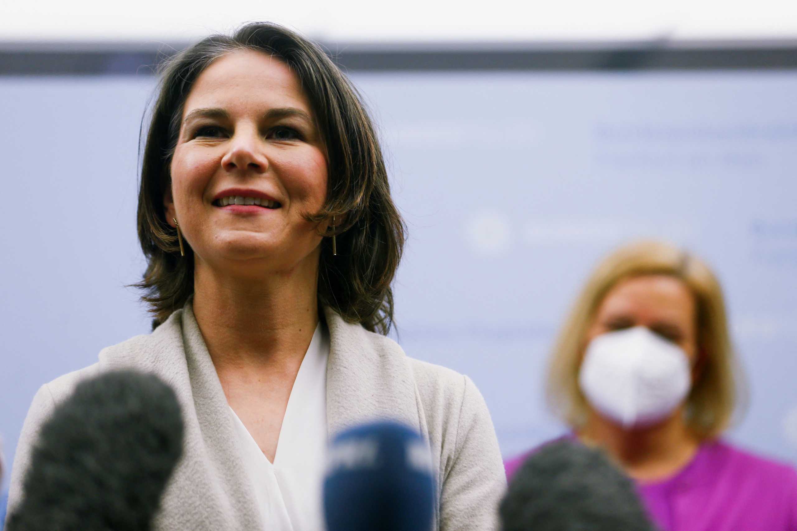 German Foreign Minister Annalena Baerbock speaks to the media after the first flight bringing Ukrainian refugees from Moldova to Germany arrived at Frankfurt Airport, following Russia's invasion of Ukraine, in Frankfurt, Germany, March 25, 2022. REUTERS