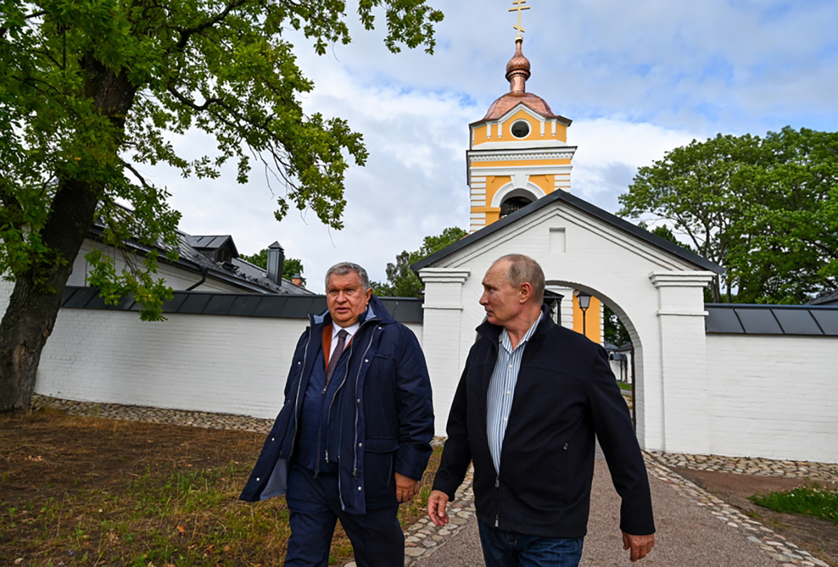 epa09385502 Russian President Vladimir Putin (R) and Russian 'Rosneft' Board Chairman Igor Sechin (L) visit the Konevsky Monastery on Konevets Island on Ladoga Lake in Leningrad region, 31 July 2021 (Issued 01 August 2021). The monastery, built at the beginning of the 19th century, was later practically destroyed. In 2016, Vladimir Putin visited Konevets and gave instructions to restore the main temple and skete of the Konevskaya Icon of the Mother of God. To date, the monastery has been restored by the forces and means of Russian oil company 'Rosneft'.  EPA