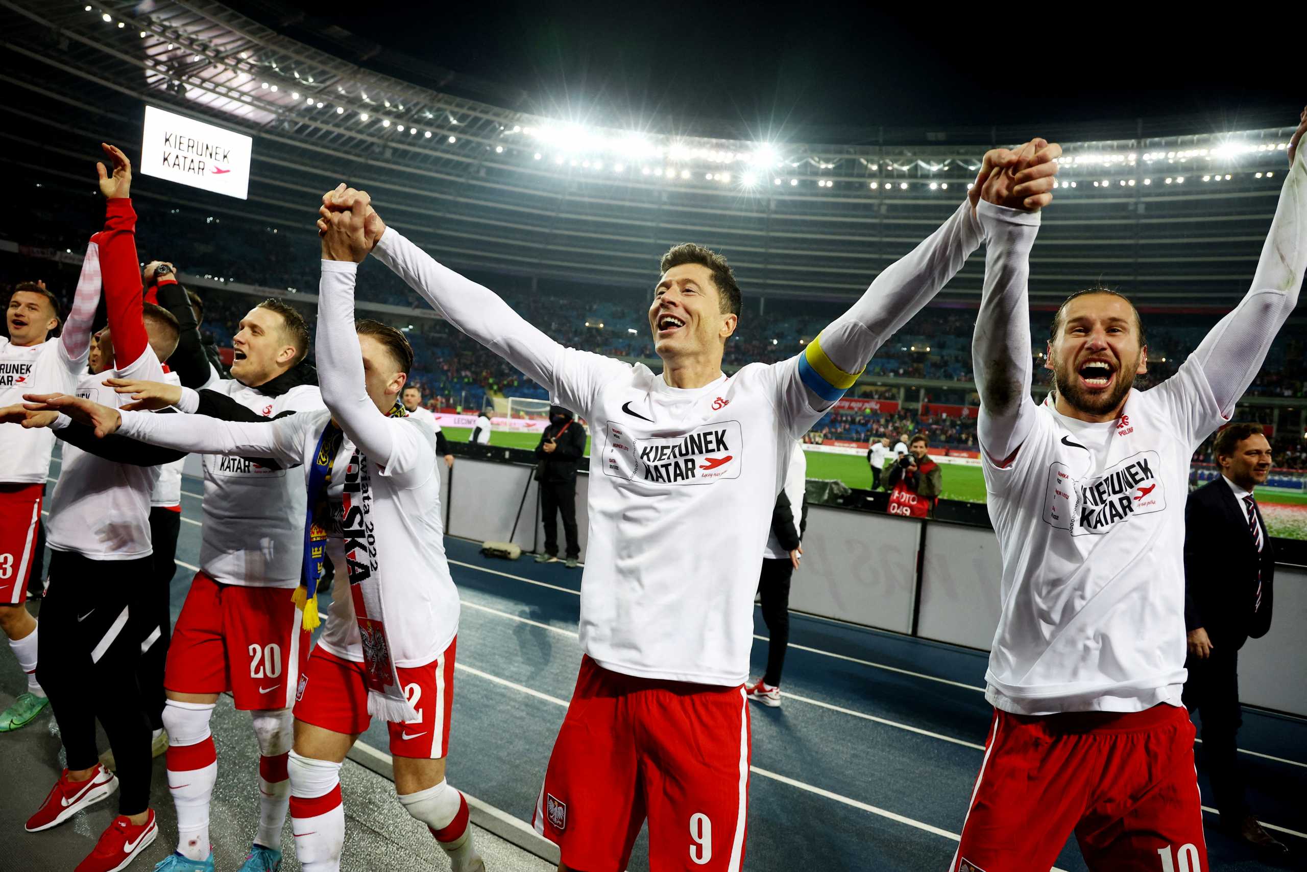 Soccer Football - World Cup - UEFA Qualifiers - Path B Playoff Final - Poland v Sweden - Silesian Stadium, Chorzow, Poland - March 29, 2022 Poland's Robert Lewandowski and Grzegorz Krychowiak celebrate after qualifying for the World Cup Qatar 2022 REUTERS