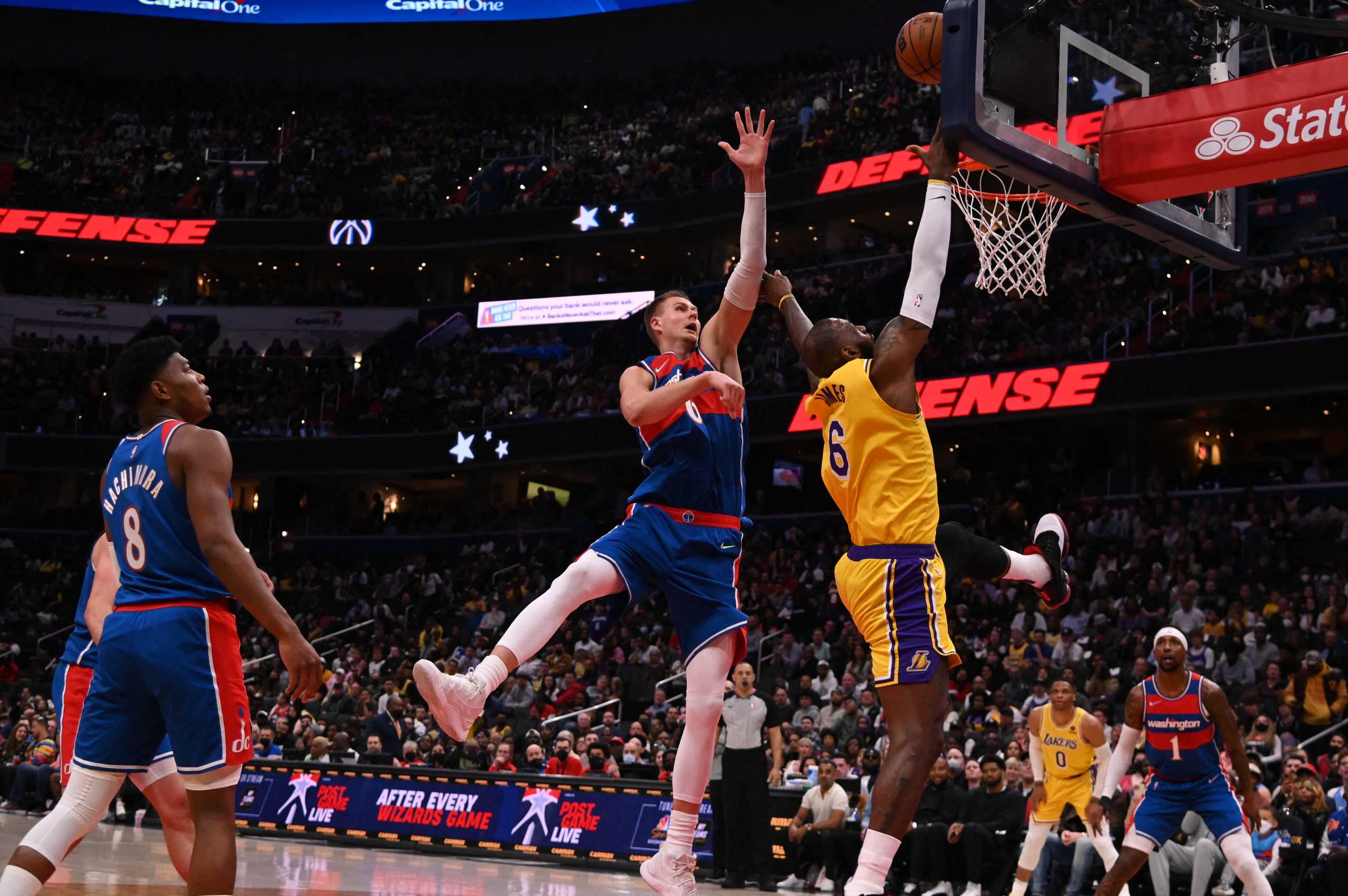 Mar 19, 2022; Washington, District of Columbia, USA; Los Angeles Lakers forward LeBron James (6) shoots on Washington Wizards center Kristaps Porzingis (6) during the first half  at Capital One Arena. Mandatory Credit: Tommy Gilligan-USA TODAY Sports