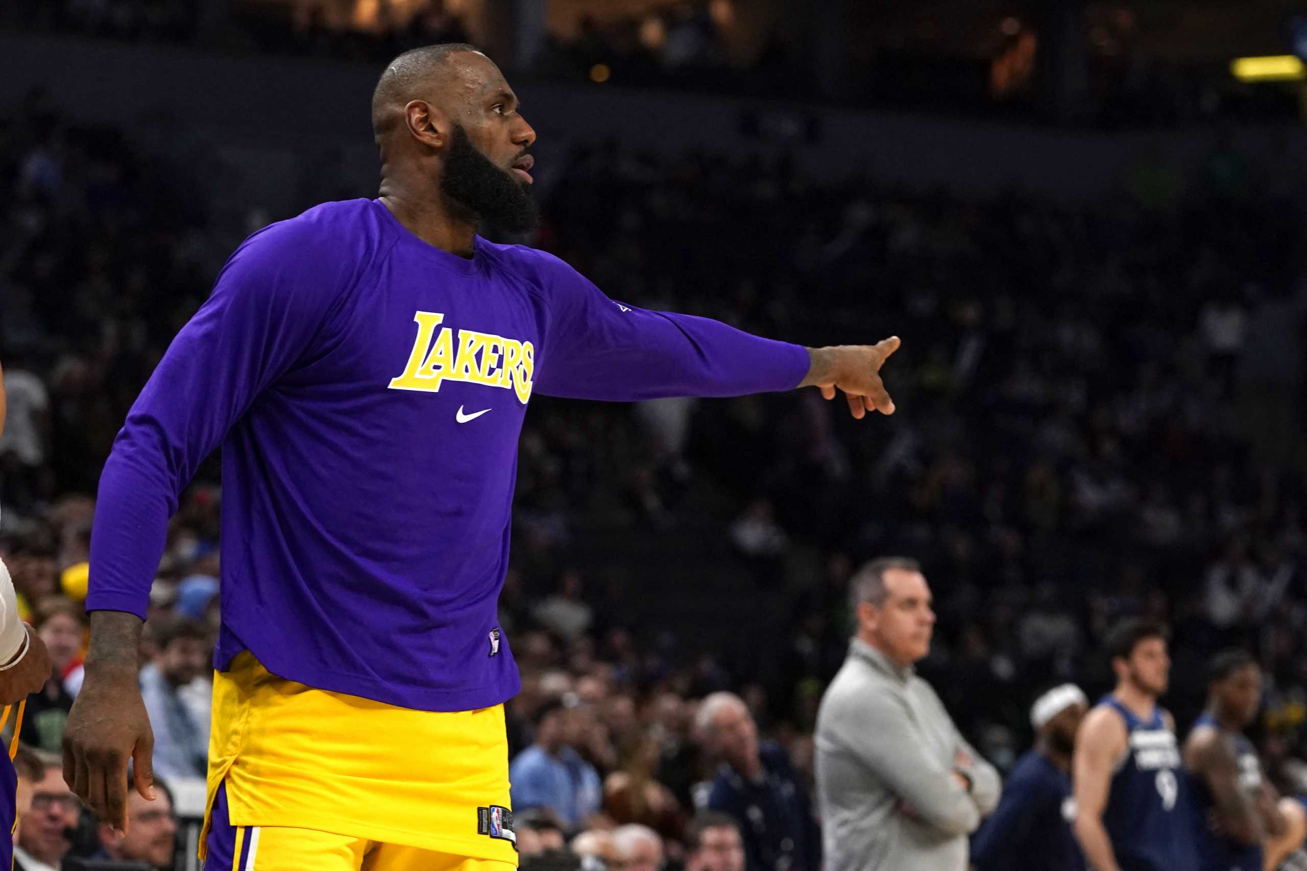 Mar 16, 2022; Minneapolis, Minnesota, USA;  Los Angeles Lakers forward LeBron James (6) has words with Minnesota Timberwolves center Karl-Anthony Towns (32) during the fourth quarter at Target Center. Mandatory Credit: Nick Wosika-USA TODAY Sports