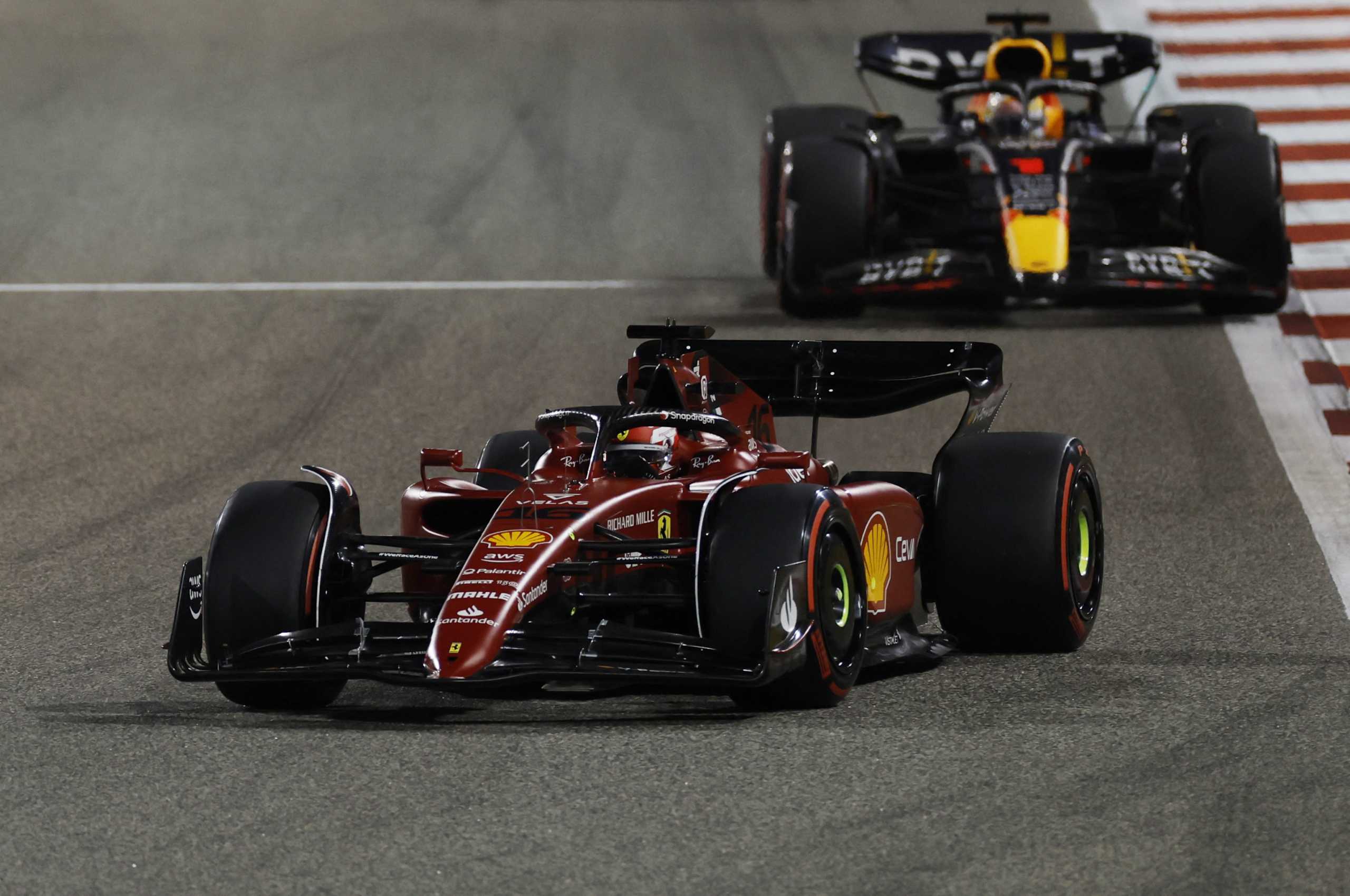 Formula One F1 - Bahrain Grand Prix - Bahrain International Circuit, Sakhir, Bahrain - March 20, 2022 Ferrari's Charles Leclerc and Red Bull's Max Verstappen in action during the race REUTERS