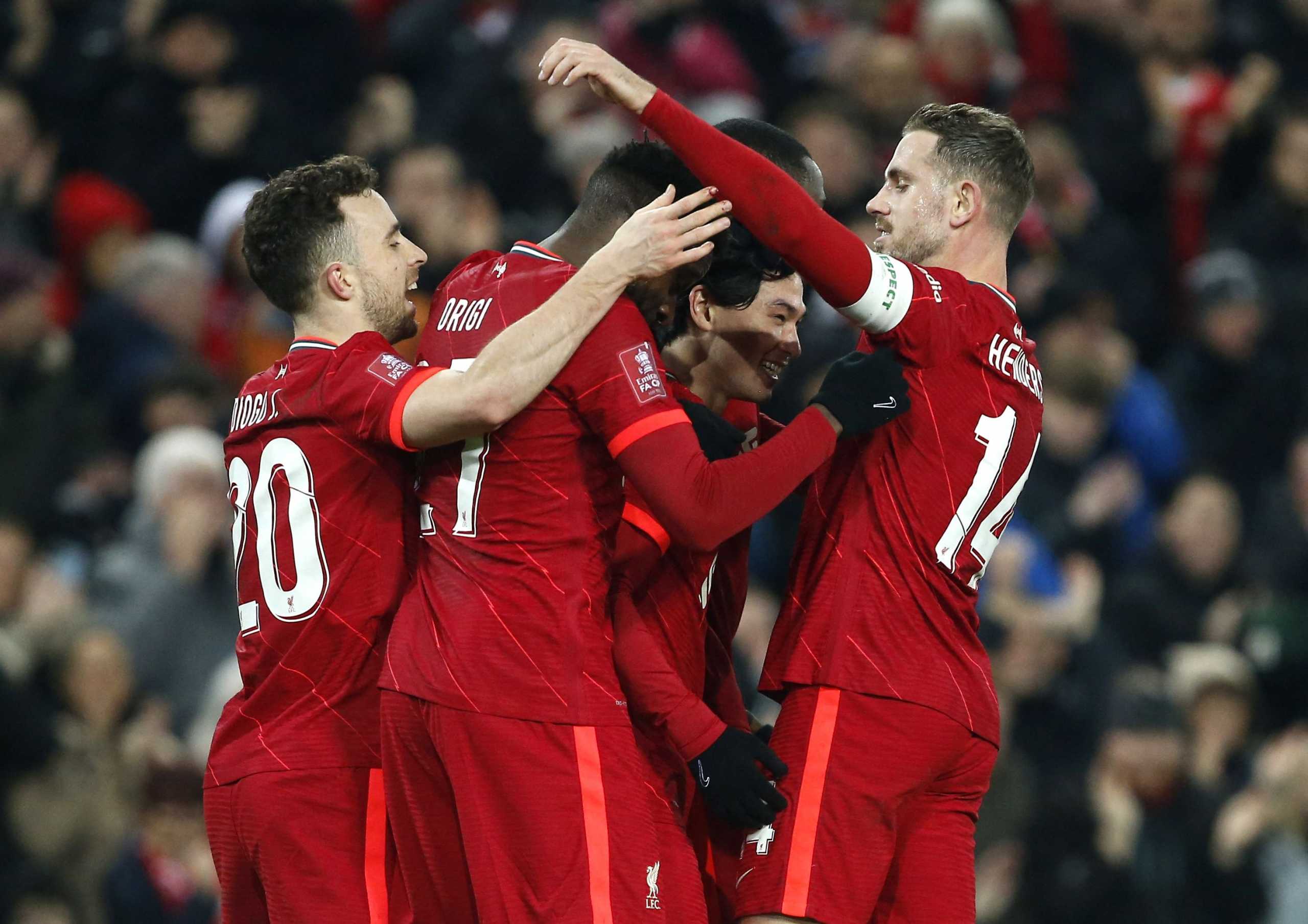 Soccer Football - FA Cup Fifth Round - Liverpool v Norwich City - Anfield, Liverpool, Britain - March 2, 2022 Liverpool's Takumi Minamino celebrates scoring their second goal with teammates REUTERS