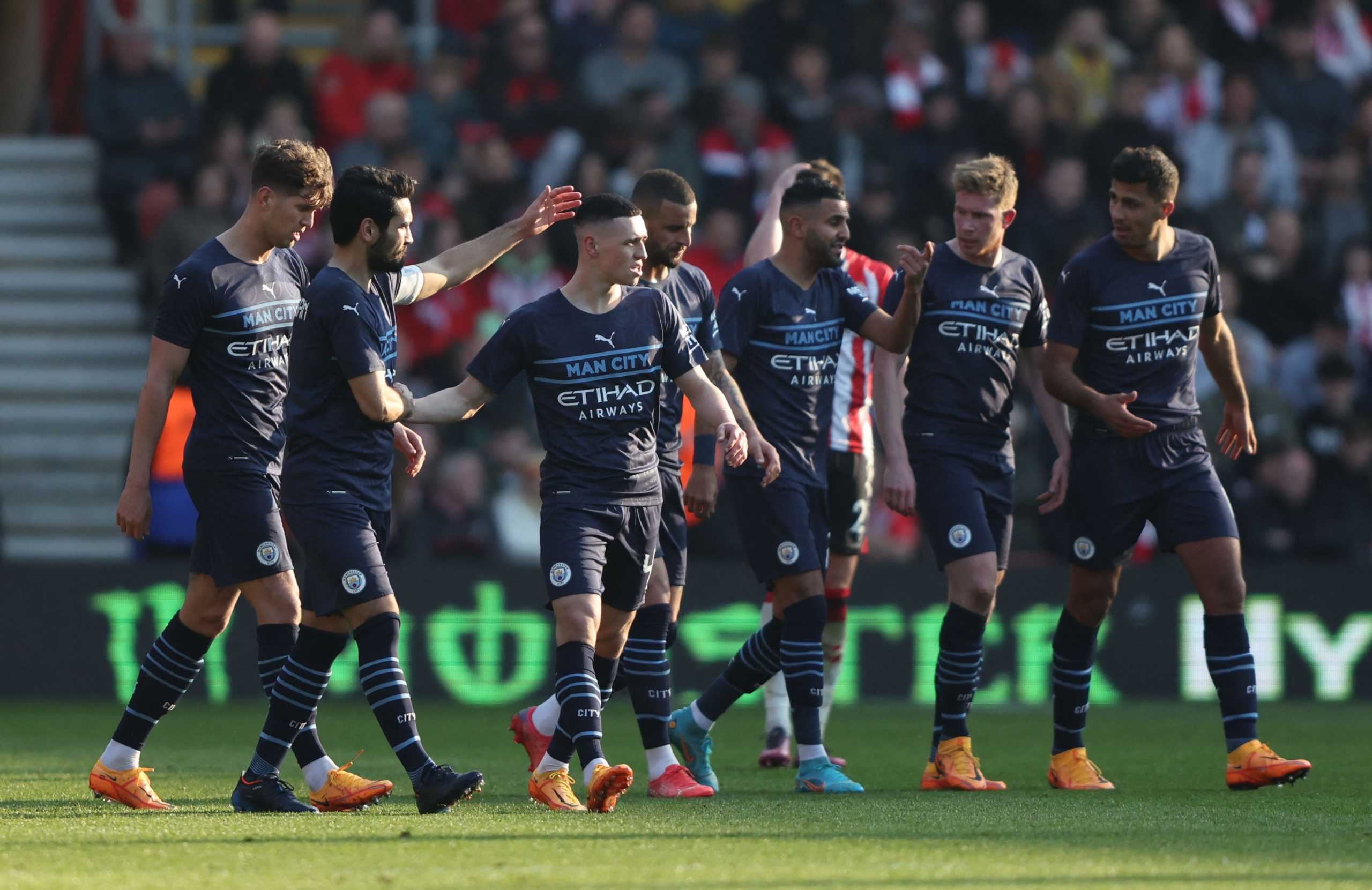 Soccer Football - FA Cup Quarter Final - Southampton v Manchester City - St Mary's Stadium, Southampton, Britain - March 20, 2022 Manchester City's Phil Foden celebrates scoring their third goal with teammates REUTERS