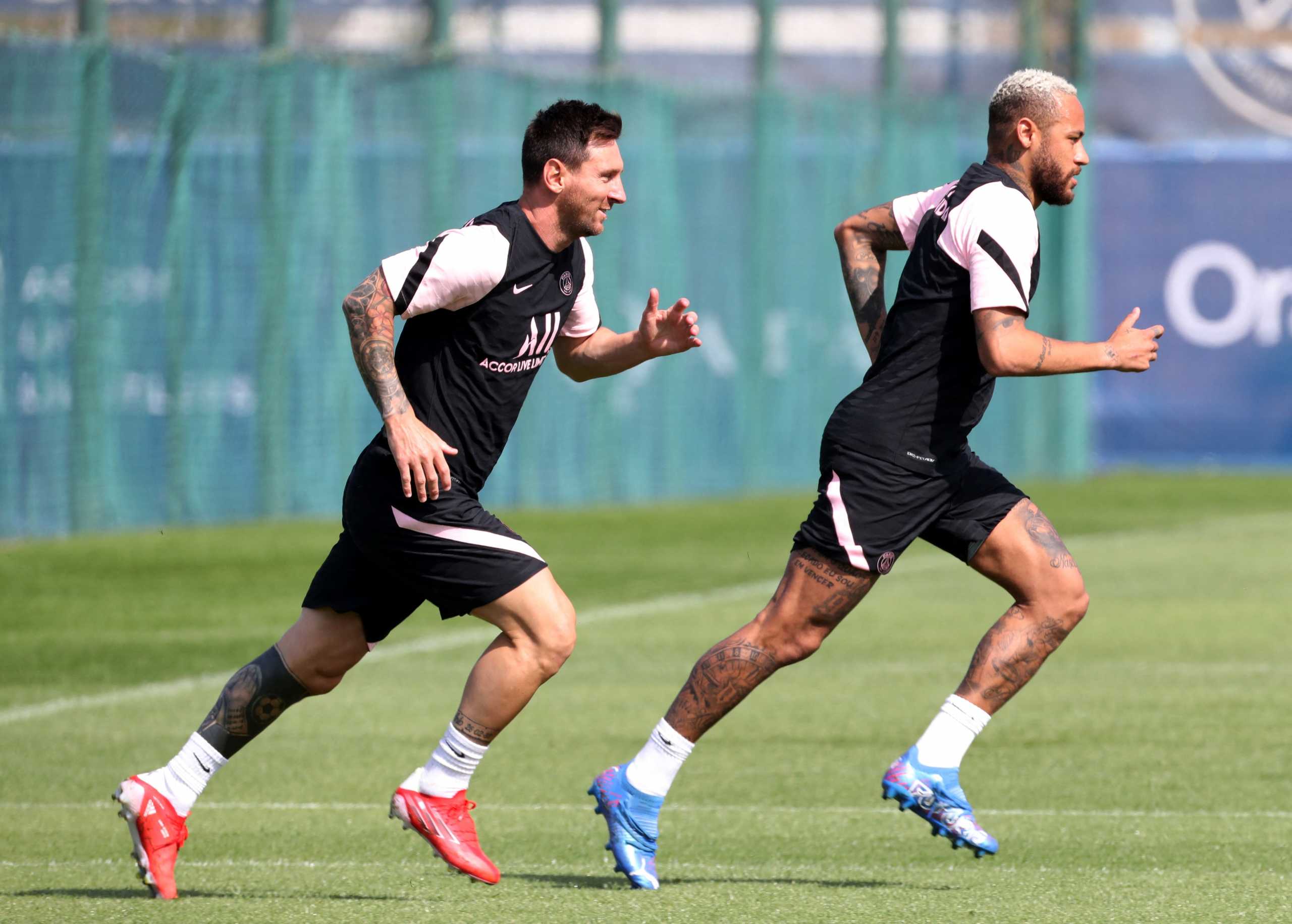 FILE PHOTO: Soccer Football - Paris St Germain Training - Ooredoo Training Centre, Saint-Germain-en-Laye, France - August 13, 2021 Paris St Germain's Lionel Messi and Neymar during training REUTERS