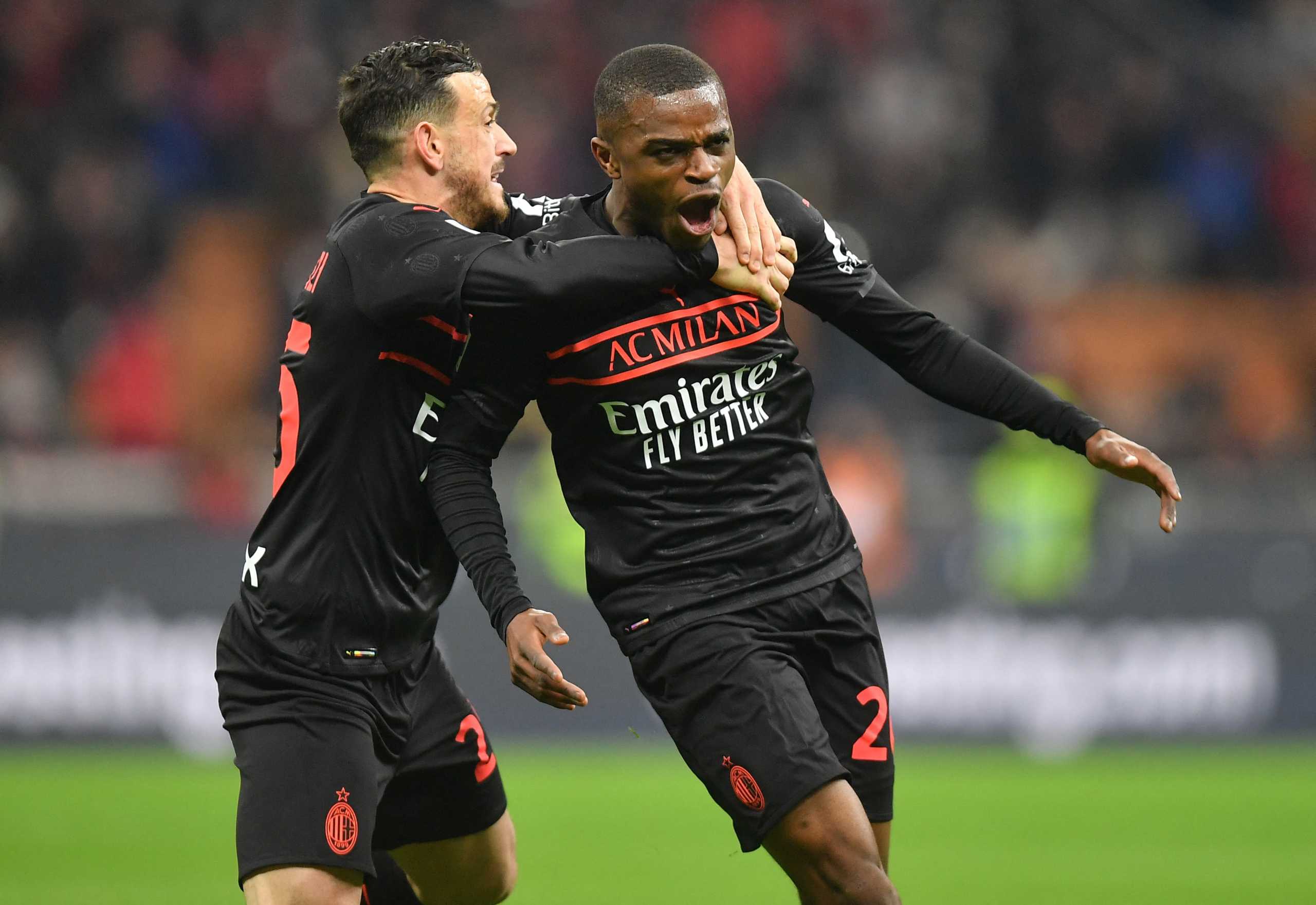 Soccer Football - Serie A - AC Milan v Empoli - San Siro, Milan, Italy - March 12, 2022 AC Milan's Pierre Kalulu celebrates scoring their first goal with Alessandro Florenzi REUTERS