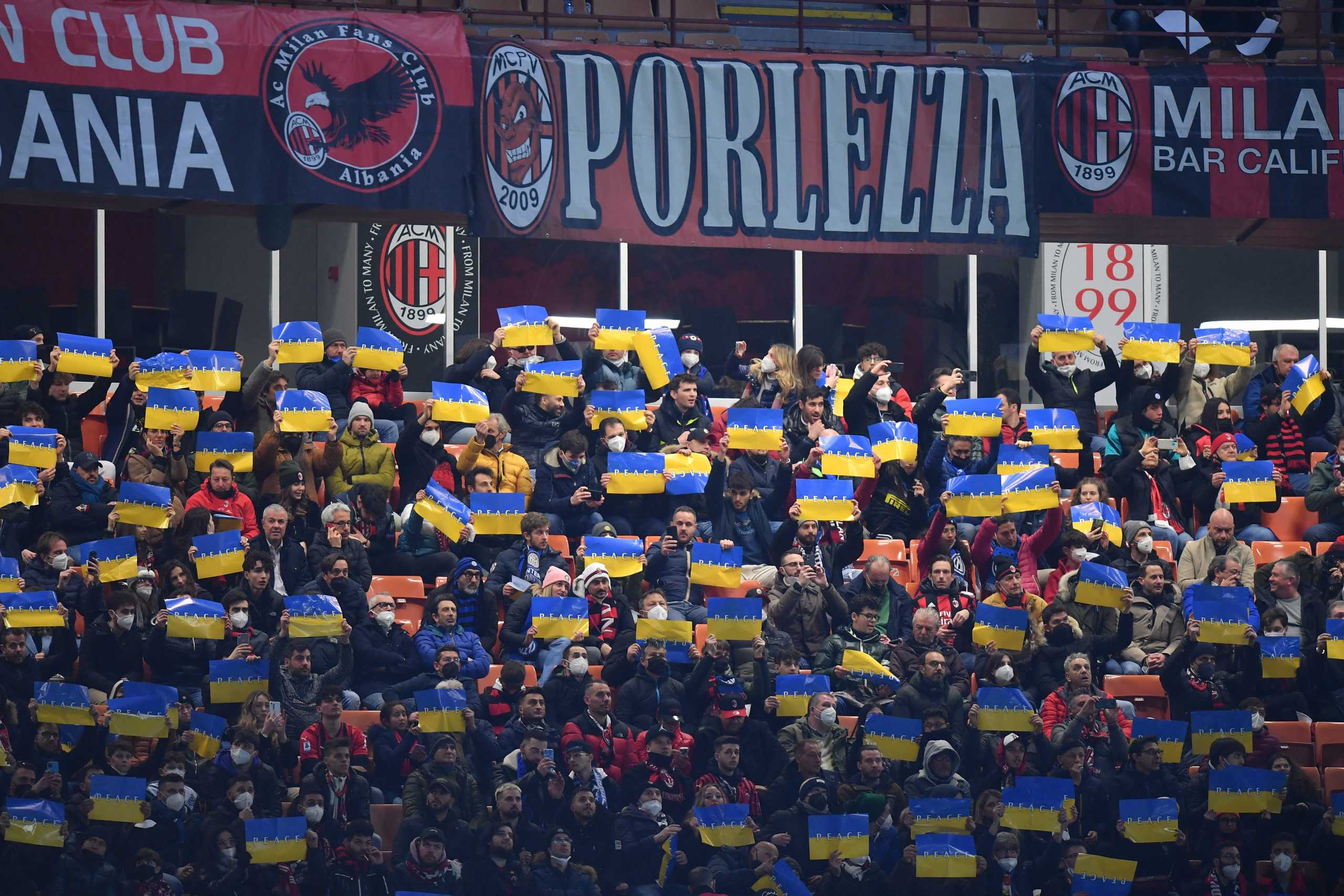 Soccer Football - Coppa Italia - Semi Final First Leg - AC Milan v Inter Milan - San Siro, Milan, Italy - March 1, 2022 Fans display the Ukraine flag inside the stadium REUTERS