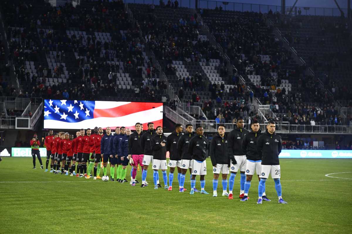 Feb 26, 2022; Washington, District of Columbia, USA; The Charlotte FC line up for the national anthem before the game against the D.C. United at Audi Field. Mandatory Credit: Brad Mills-USA TODAY Sports