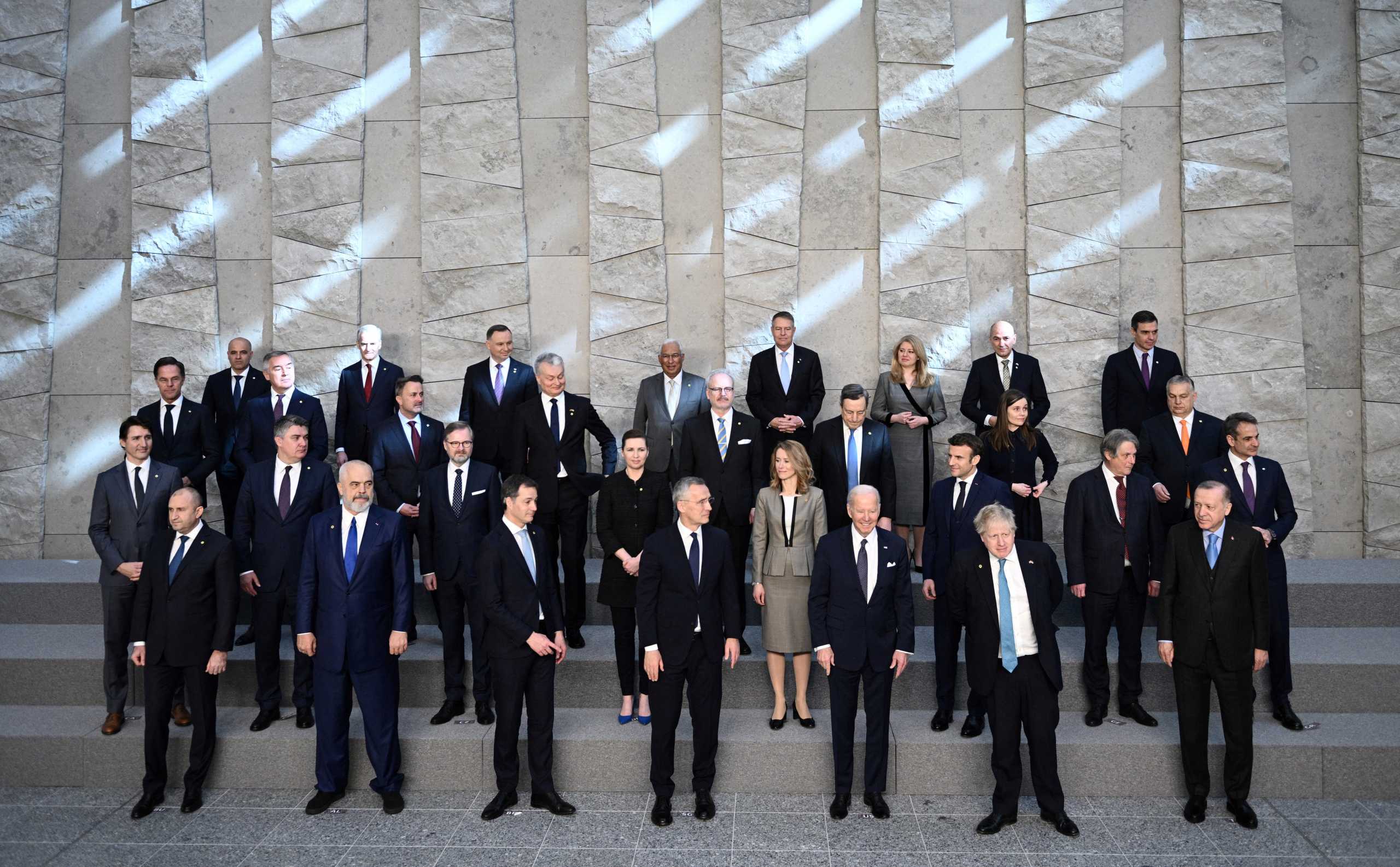 Turkey's President Recep Tayyip Erdogan, Britain's Prime Minister Boris Johnson, US President Joe Biden, NATO Secretary General Jens Stoltenberg, Belgium's Prime Minister Alexander De Croo and leaders of the US-led military alliance pose for a family photo at NATO Headquarters in Brussels, Belgium, March 24, 2022. Brendan Smialowski