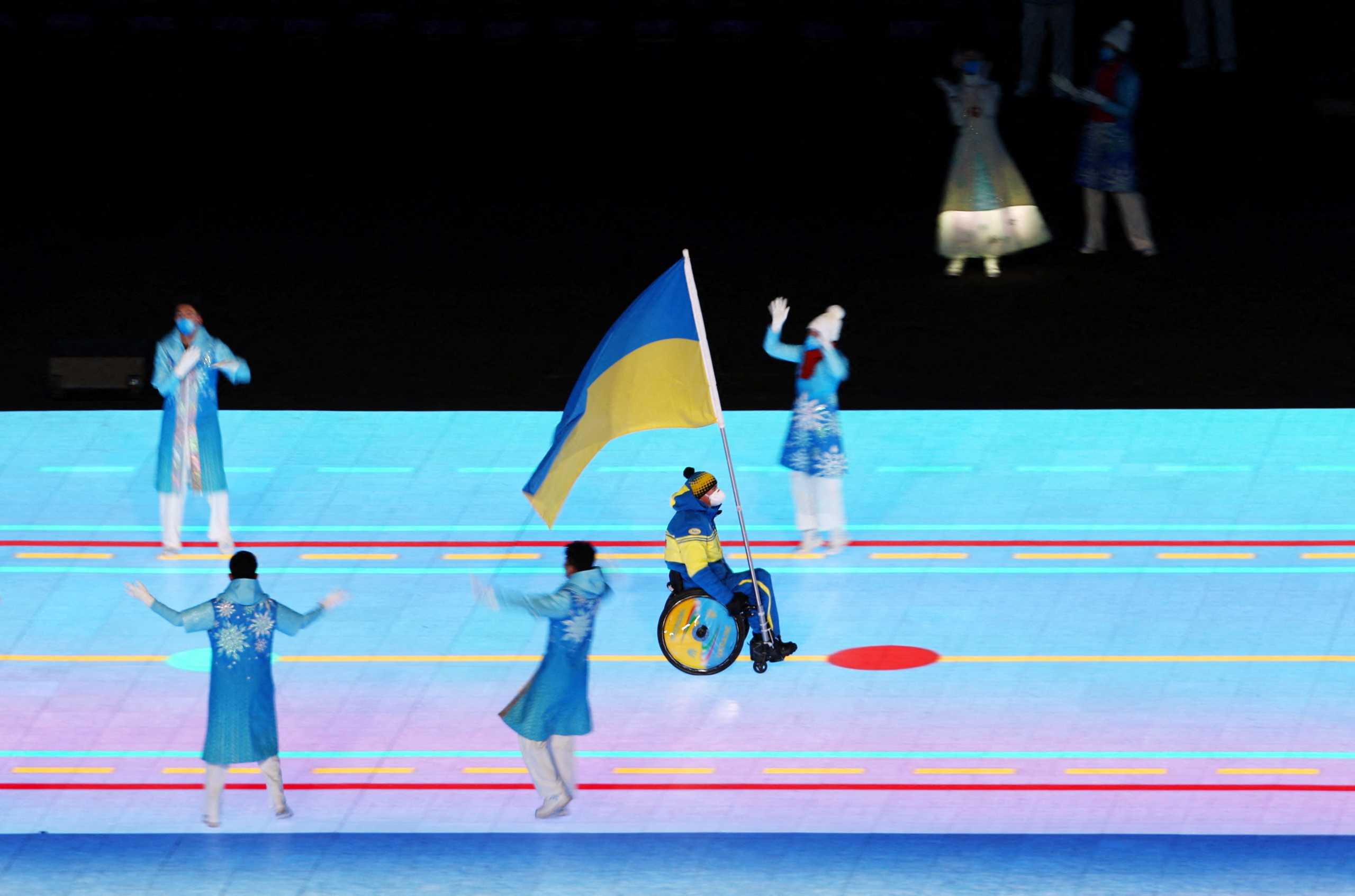 Beijing 2022 Winter Paralympic Games - Opening Ceremony - National Stadium, Beijing, China - March 4, 2022. Flagbearer Maksym Yarovyi of Ukraine during the athletes parade. REUTERS