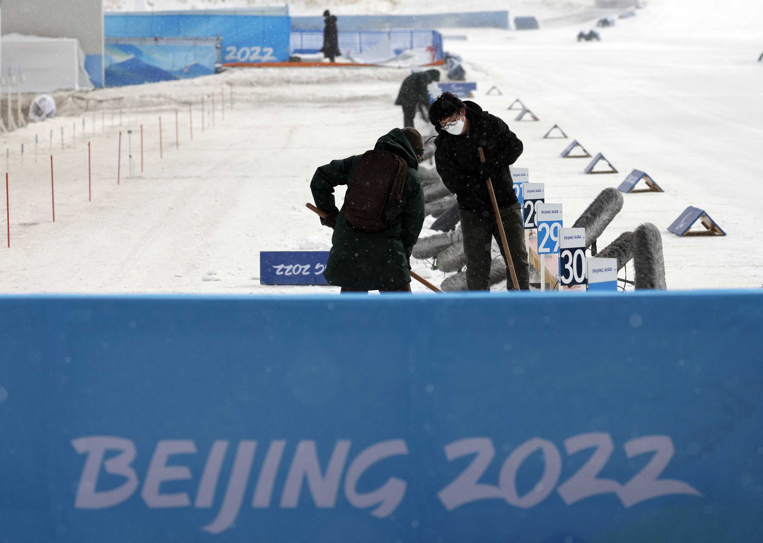 Beijing 2022 Winter Paralympic Games - Beijing 2022 Winter Paralympic Games Preview - National Biathlon Centre, Zhangjiakou, China - March 4, 2022. Officials check the conditions at the shooting range of the National Biathlon Centre during bad weather ahead of the Beijing 2022 Winter Paralympic Games REUTERS