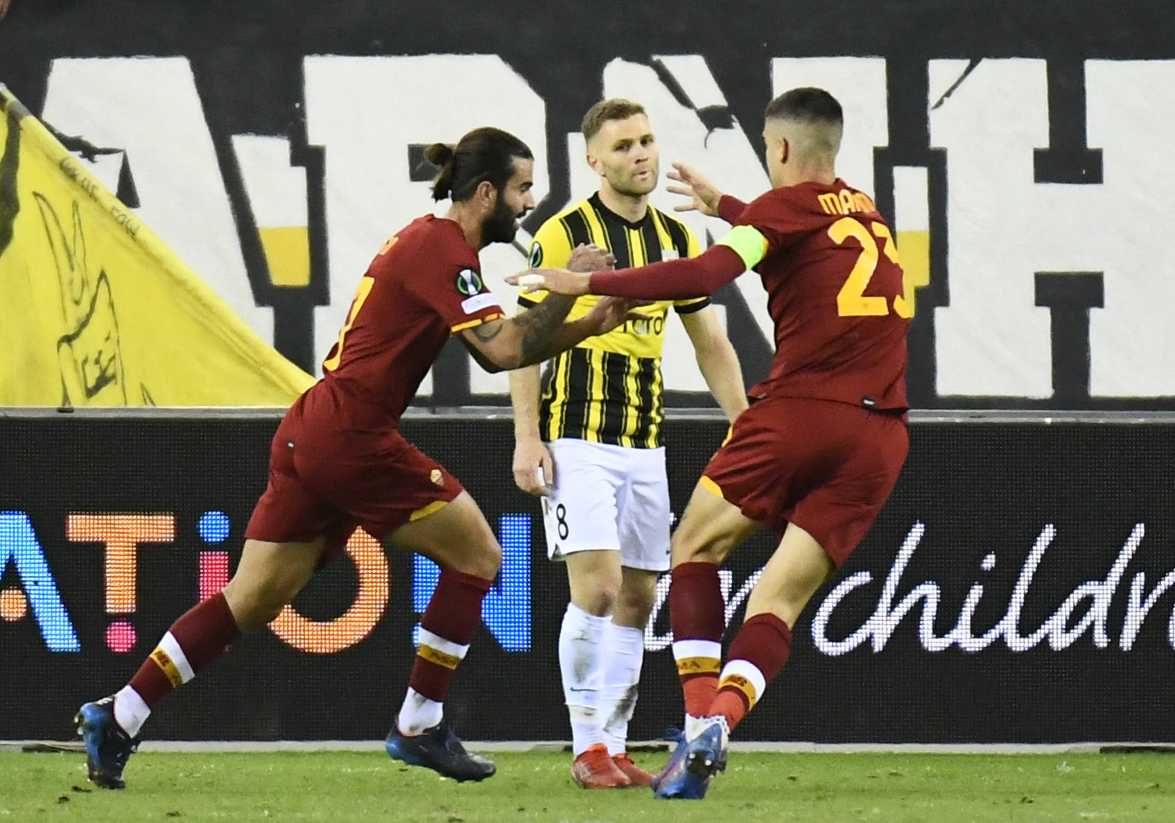 Soccer Football - Europa League - Round of 16 First Leg - Vitesse Arnhem v AS Roma - GelreDome, Arnhem, Netherlands - March 10, 2022 AS Roma's Sergio Oliveira celebrates scoring their first goal with Gianluca Mancini as Vitesse Arnhem's Sondre Tronstad looks dejected REUTERS