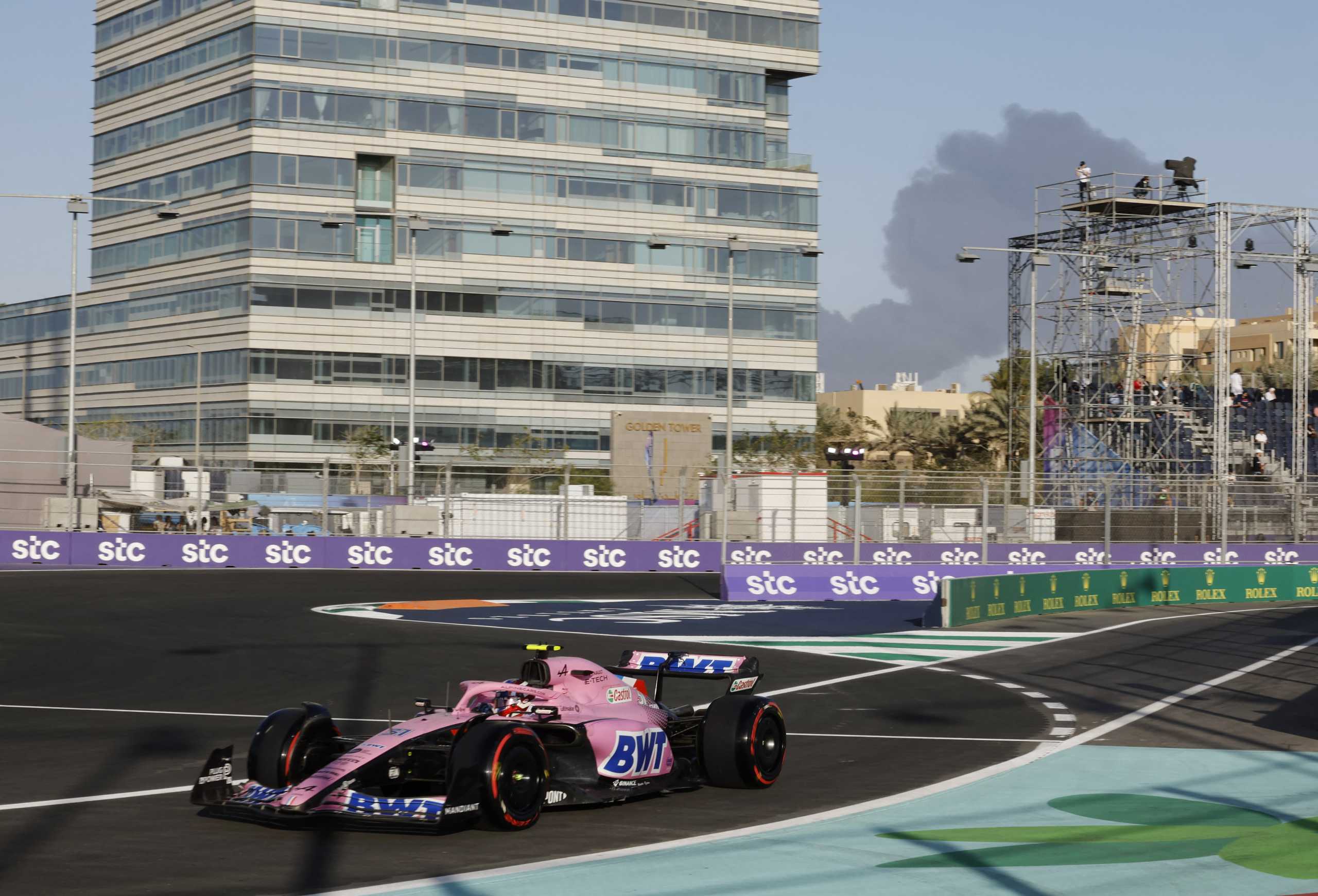 Formula One F1 - Saudi Arabia Grand Prix - Jeddah Corniche Circuit, Jeddah, Saudi Arabia - March 25, 2022 Alpine's Esteban Ocon during practice as smoke is seen in the background REUTERS