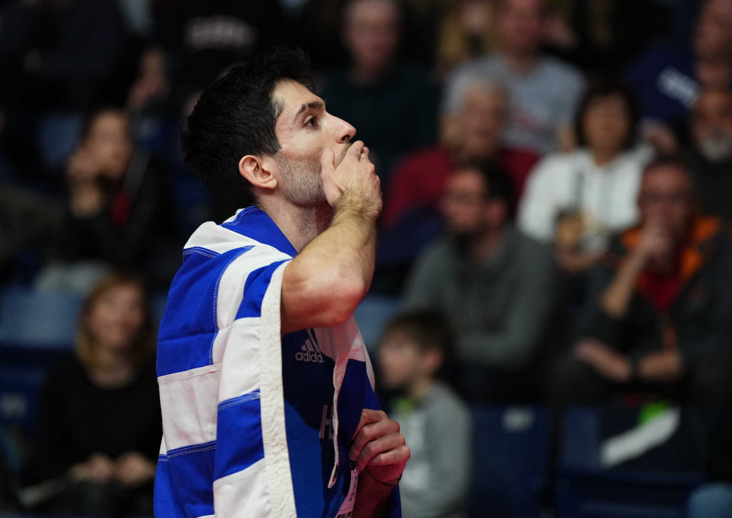 Athletics - World Athletics Indoor Championships - Stark Arena, Belgrade, Serbia - March 18, 2022  Greece's Miltiadis Tentoglou celebrates after winning the long jump men final REUTERS