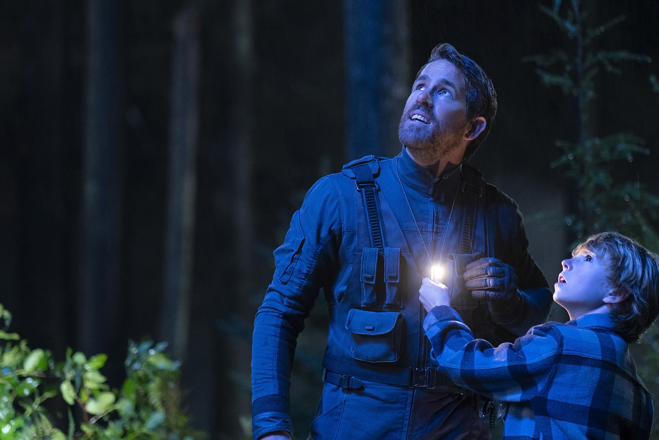 The Adam Project (L to R) Ryan Reynolds as Big Adam and Walker Scobell as Young Adam. Cr. Doane Gregory