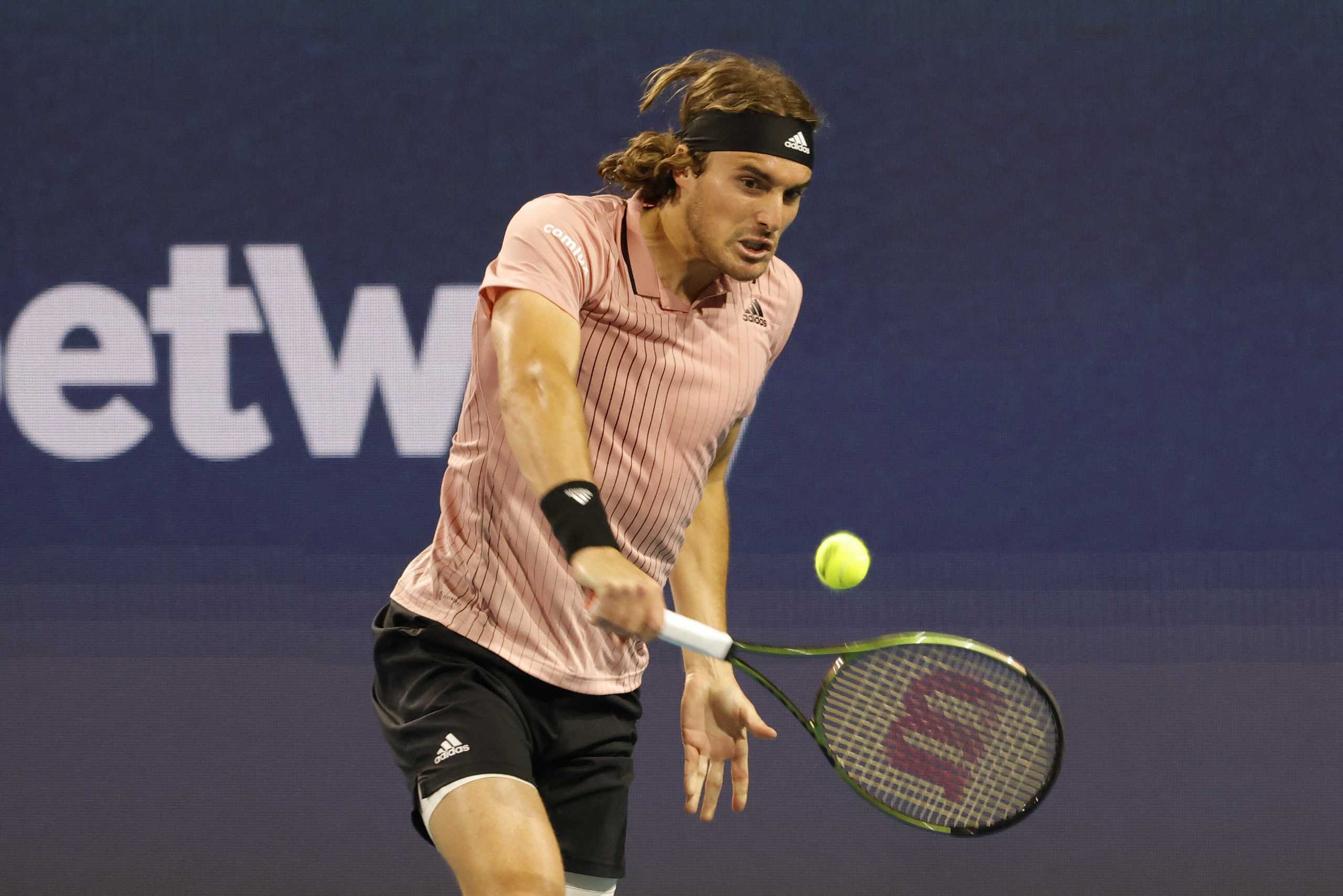 Mar 26, 2022; Miami Gardens, FL, USA; Stefanos Tsitsipas (GRE) hits a backhand against J.J. Wolf (USA)(not pictured) in a second round men's singles match in the Miami Open at Hard Rock Stadium. Mandatory Credit: Geoff Burke-USA TODAY Sports