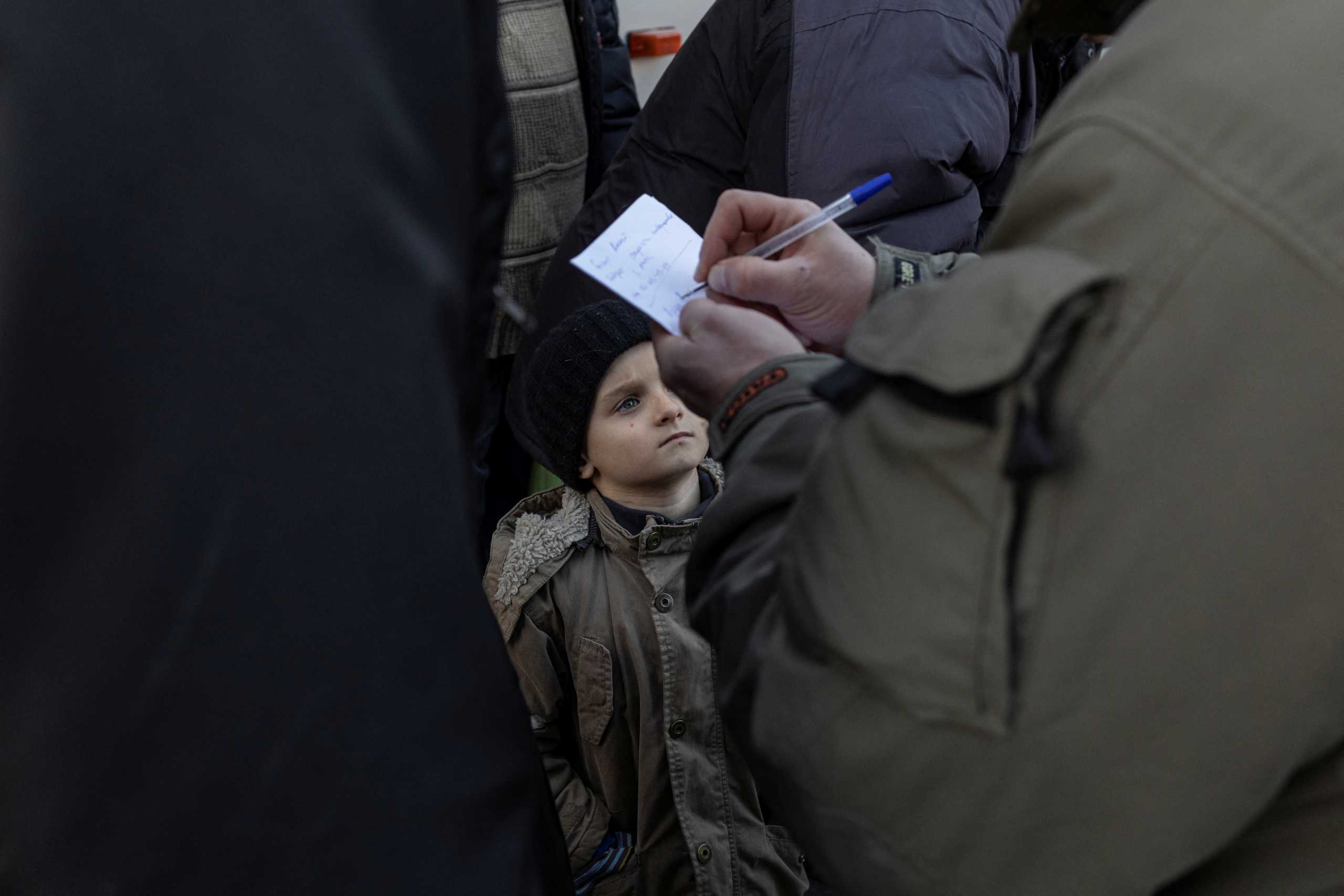 Evacuees from the villages occupied by Russian soldiers arrive in the town of Brovary, amid Russia's invasion of Ukraine, near Kyiv, Ukraine, March 20, 2022. REUTERS
