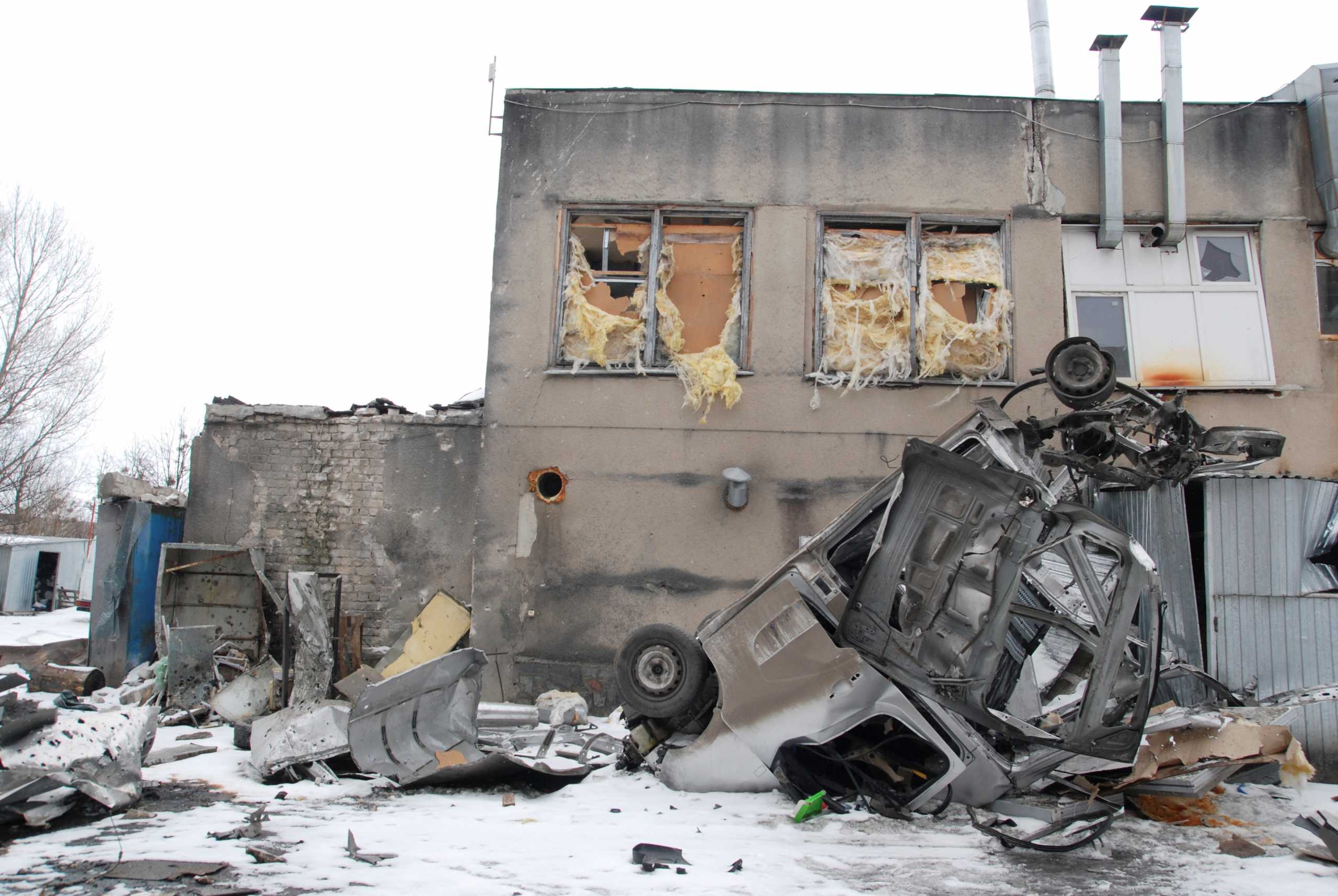 A damaged van is seen outside a tram depot, amid Russia's invasion of Ukraine, in Kharkiv, Ukraine March 14, 2022. REUTERS
