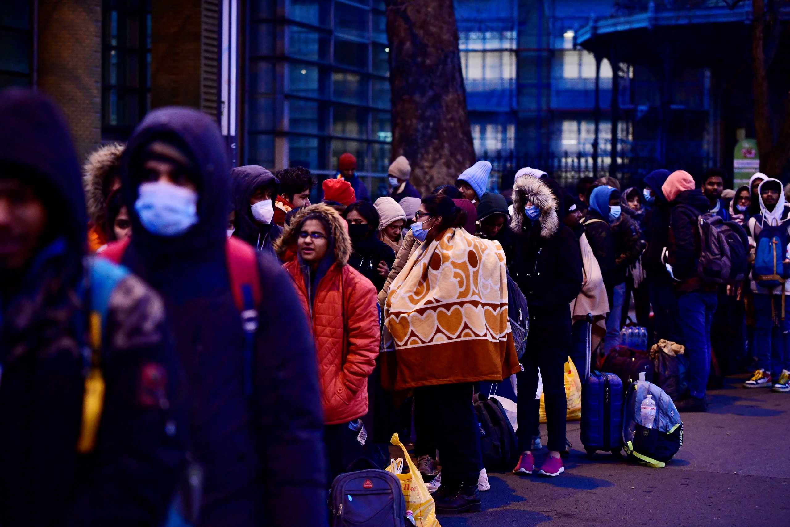 Refugees fleeing from Ukraine wait for transport at Nyugati station, following Russia's invasion of Ukraine, in Budapest, Hungary March 3, 2022. REUTERS