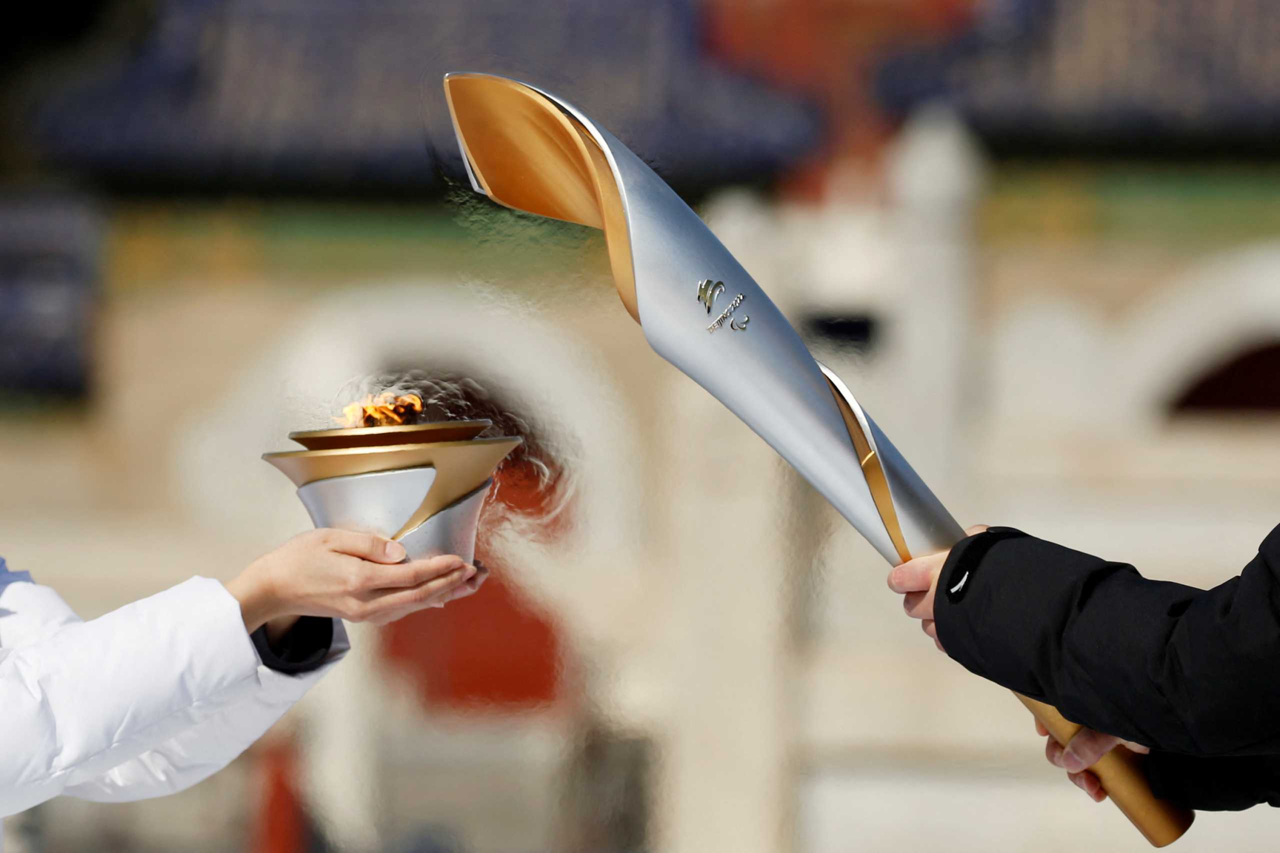 Olympics - Beijing 2022 Winter Paralympics - Torch Relay - Beijing, China - March 2, 2022. Participants take part in the flame lighting ceremony at the Temple of Heaven. REUTERS