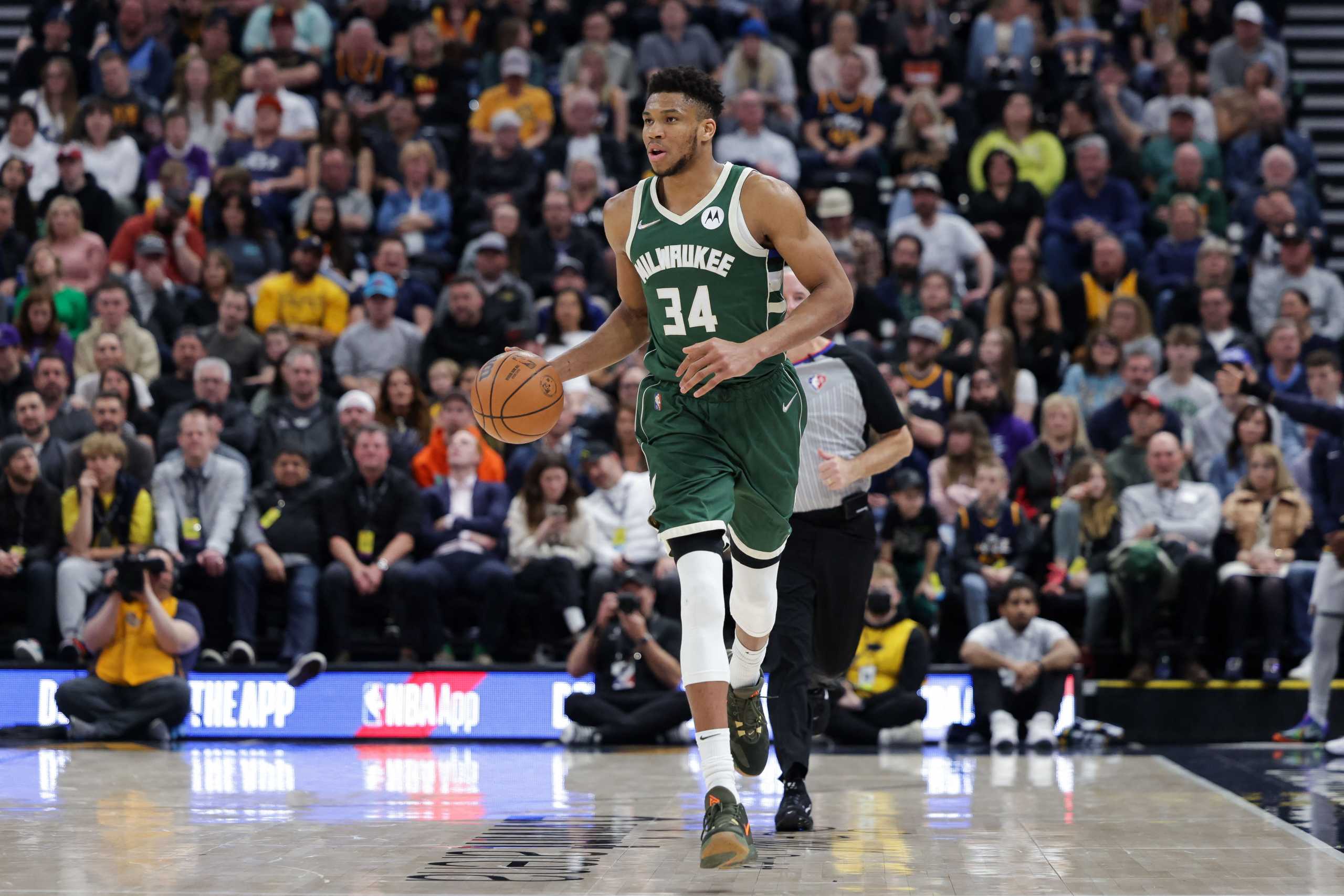 Mar 14, 2022; Salt Lake City, Utah, USA; Milwaukee Bucks forward Giannis Antetokounmpo (34) dribbles the ball up the court during the second half against the Utah Jazz at Vivint Arena. Milwaukee Bucks won 117-111. Mandatory Credit: Chris Nicoll-USA TODAY Sports