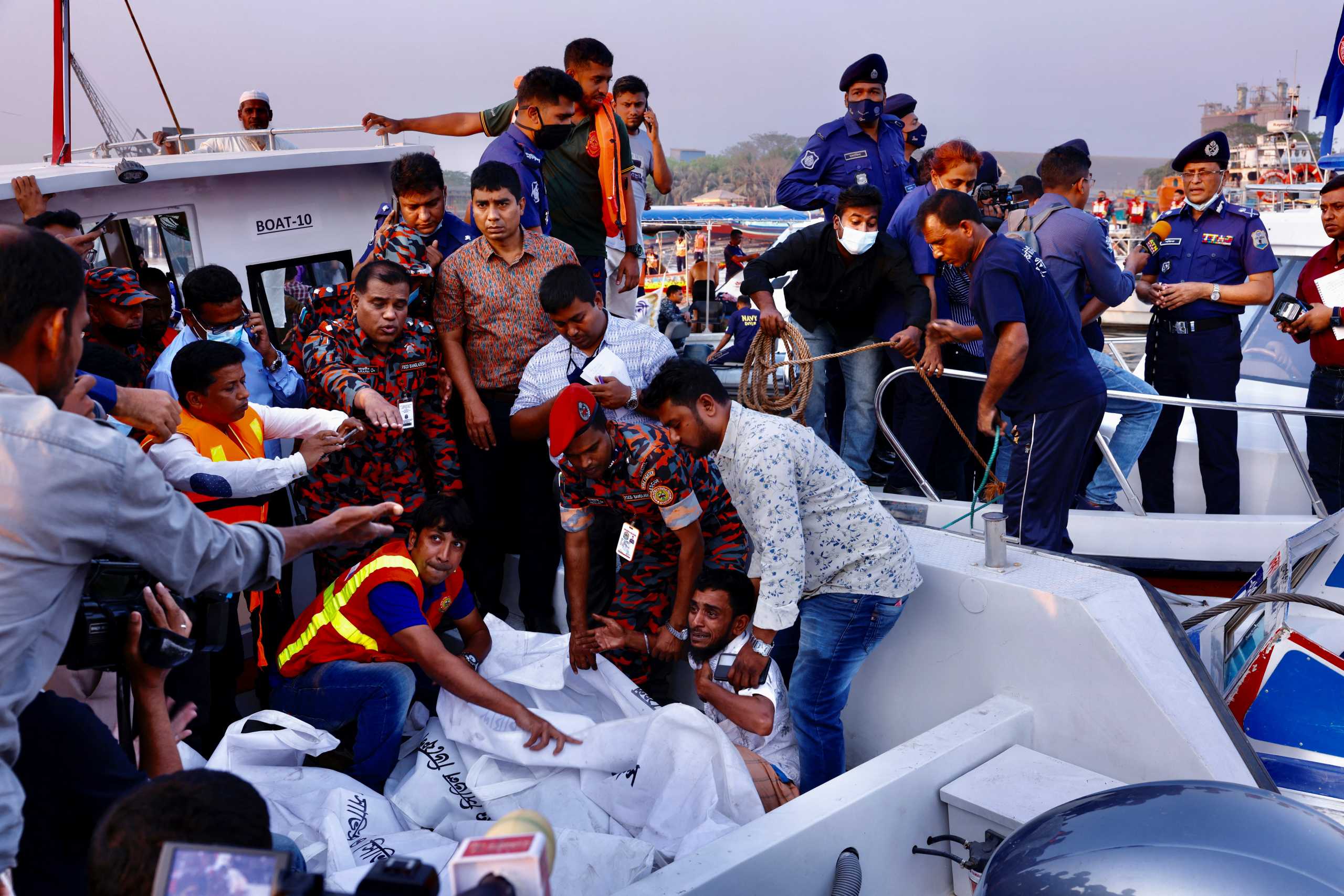A relative of one of the victims mourns as a ferry sank after colliding with a sand carrier ship in Narayanganj, Bangladesh, March 20, 2022. REUTERS