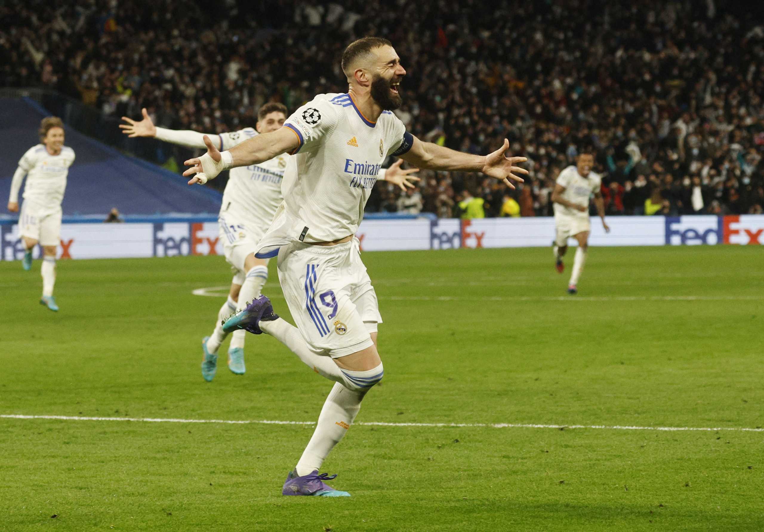 Soccer Football - Champions League - Round of 16 Second Leg - Real Madrid v Paris St Germain - Santiago Bernabeu, Madrid, Spain - March 9, 2022 Real Madrid's Karim Benzema celebrates scoring their third goal REUTERS