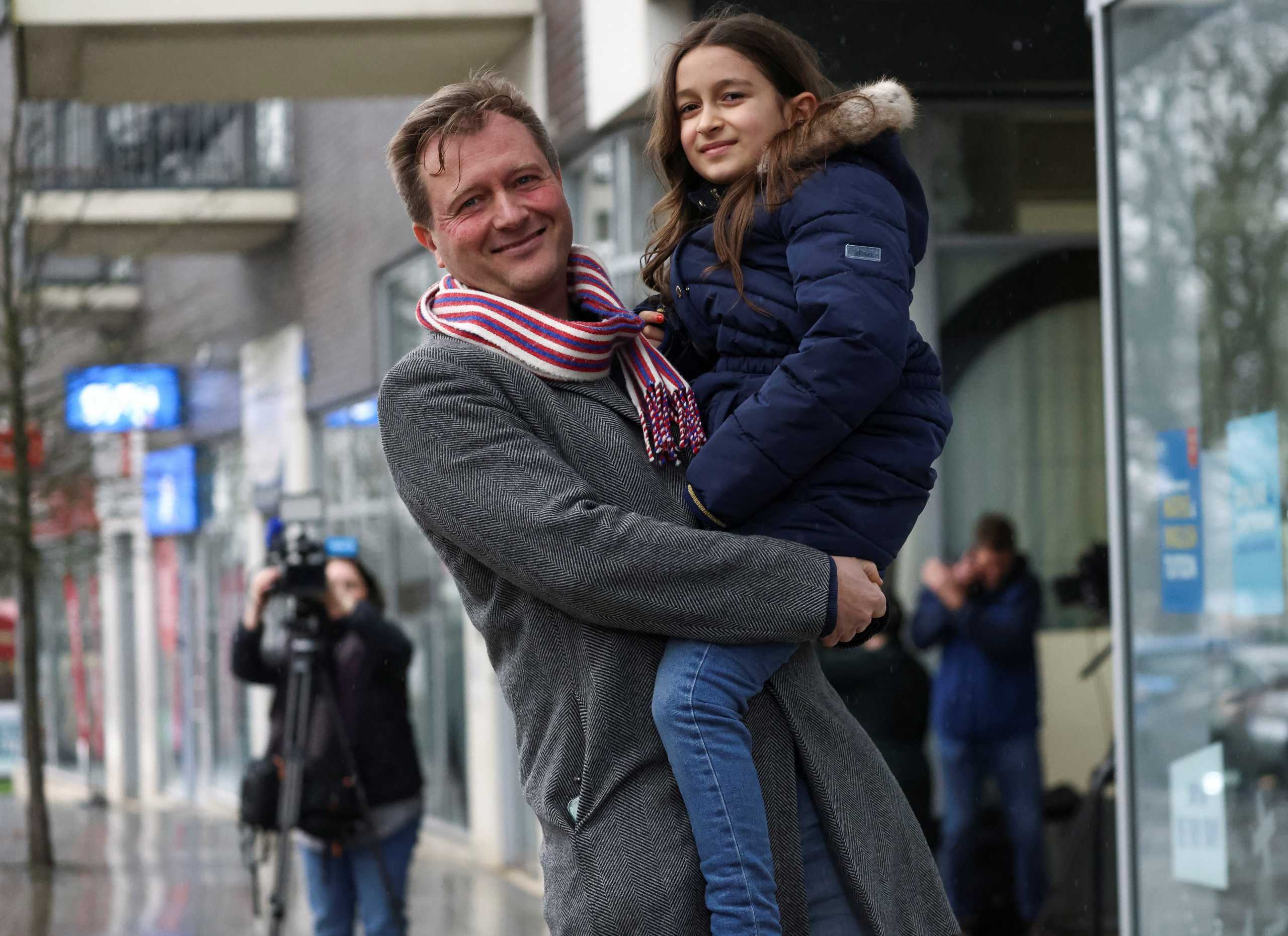 Richard Ratcliffe, husband of British-Iranian aid worker Nazanin Zaghari-Ratcliffe, carries his daughter Gabriella outside his home in London, Britain, March 16, 2022 REUTERS