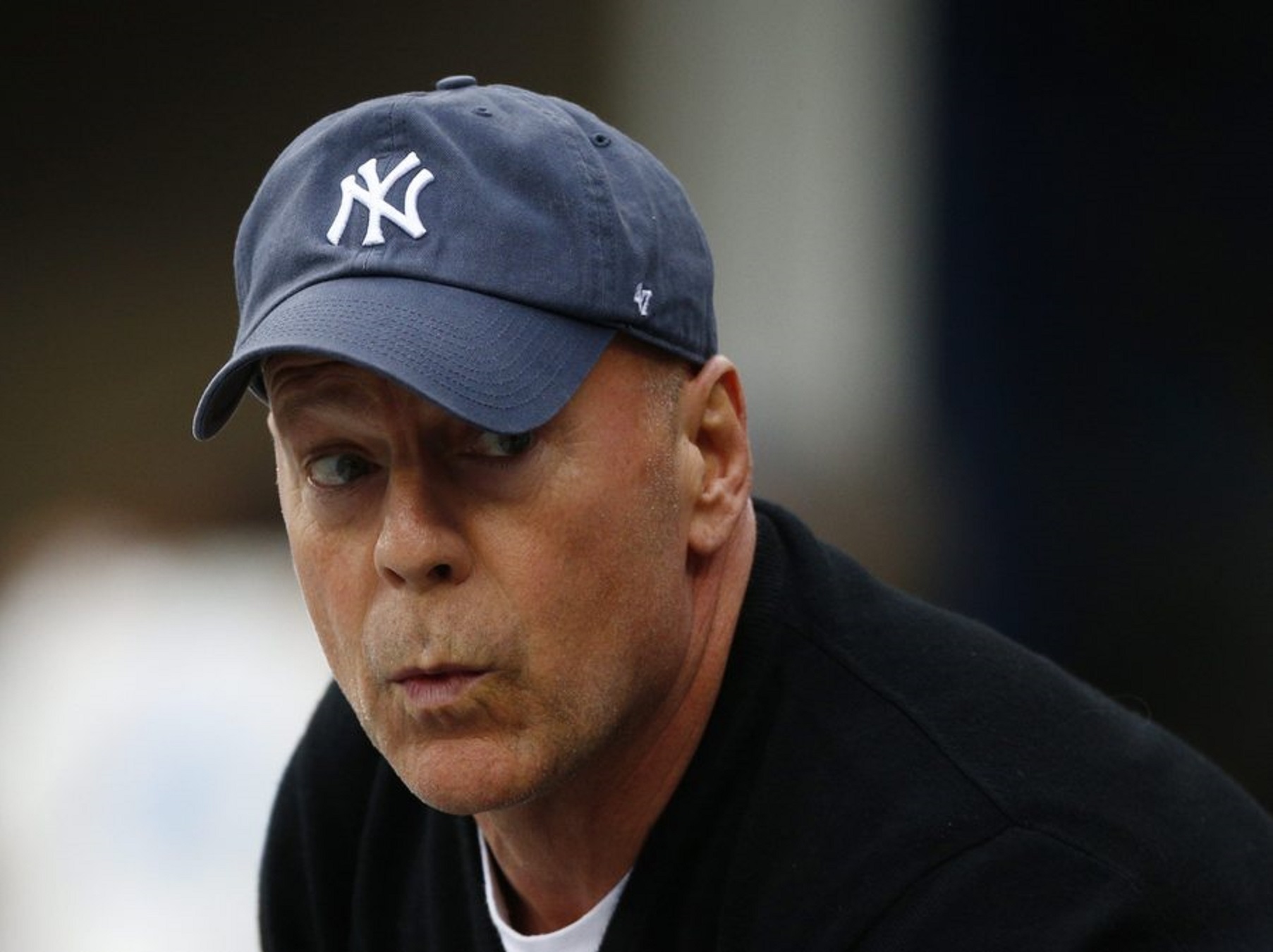 epa04391750 US actor Bruce Willis watches during the men's final match on the fifteenth day of the 2014 US Open Tennis Championship at the USTA National Tennis Center in Flushing Meadows, New York, USA, 08 September 2014. The US Open runs through 08 September, a 15-day schedule.  EPA