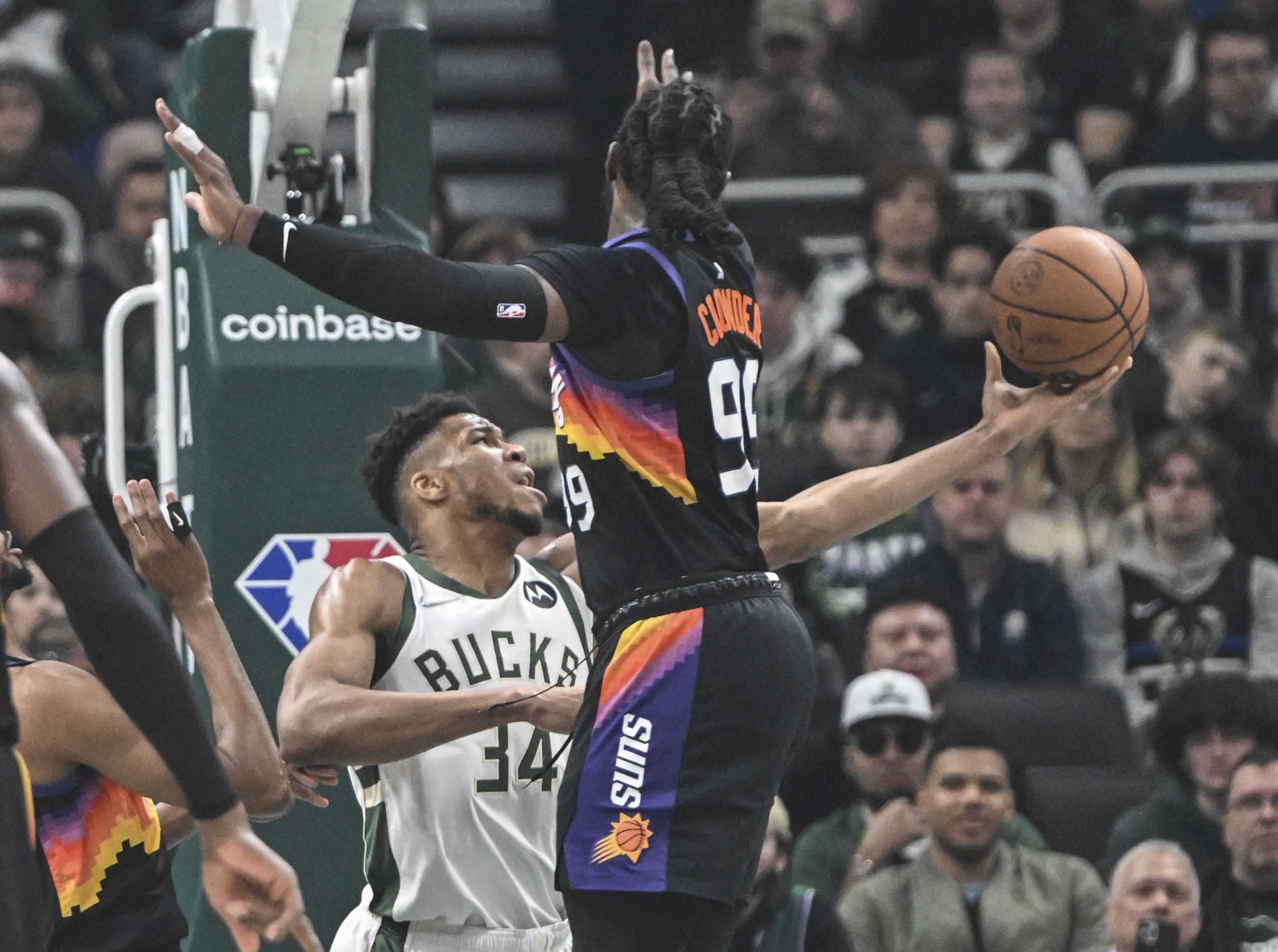 Mar 6, 2022; Milwaukee, Wisconsin, USA;  Milwaukee Bucks forward Giannis Antetokounmpo (34) takes a shot against Phoenix Suns forward Jae Crowder (99) in the first quarter at Fiserv Forum. Mandatory Credit: Benny Sieu-USA TODAY Sports