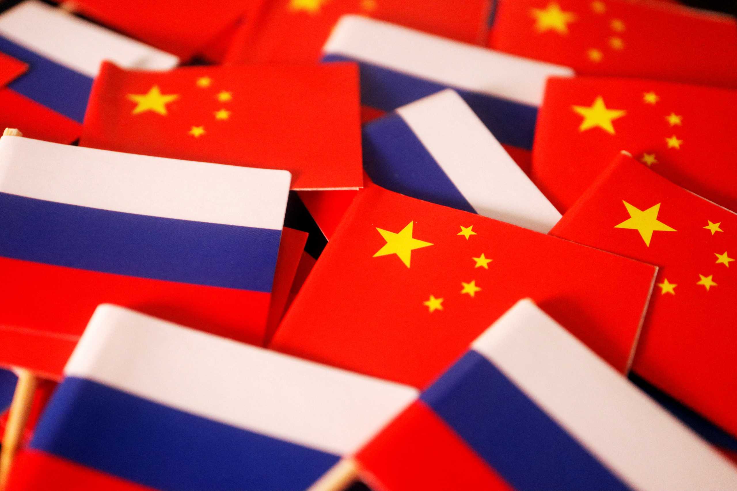 Flags of China and Russia are displayed in this illustration picture taken March 24, 2022. REUTERS