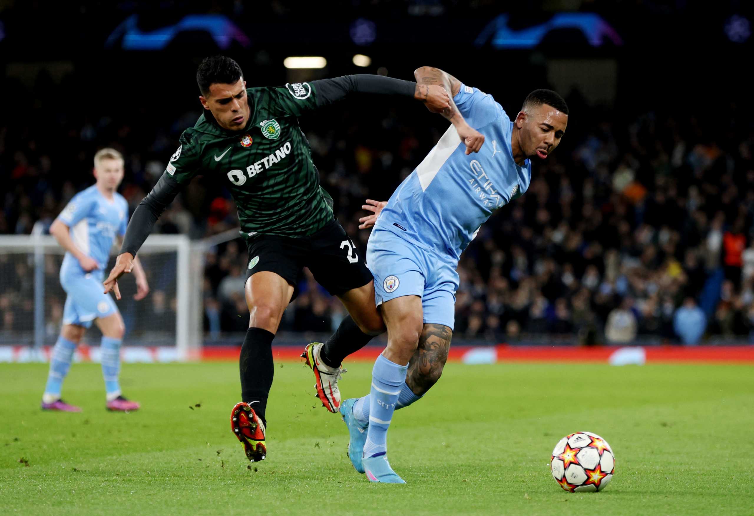 Soccer Football - Champions League - Round of 16 Second Leg - Manchester City v Sporting CP - Etihad Stadium, Manchester, Britain - March 9, 2022 Sporting CP's Pedro Porro in action with Manchester City's Gabriel Jesus Action Images via Reuters