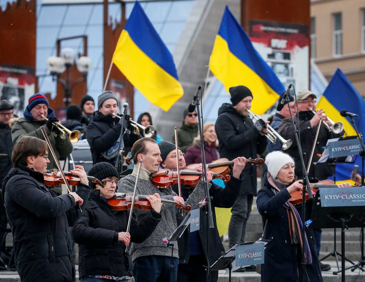 Musicians of the Kyiv-Classic Symphony Orchestra under the direction the conductor Herman Makarenko perform during an open-air concert named "Free Sky" at the Independence Square in central Kyiv, Ukraine March 9, 2022. REUTERS