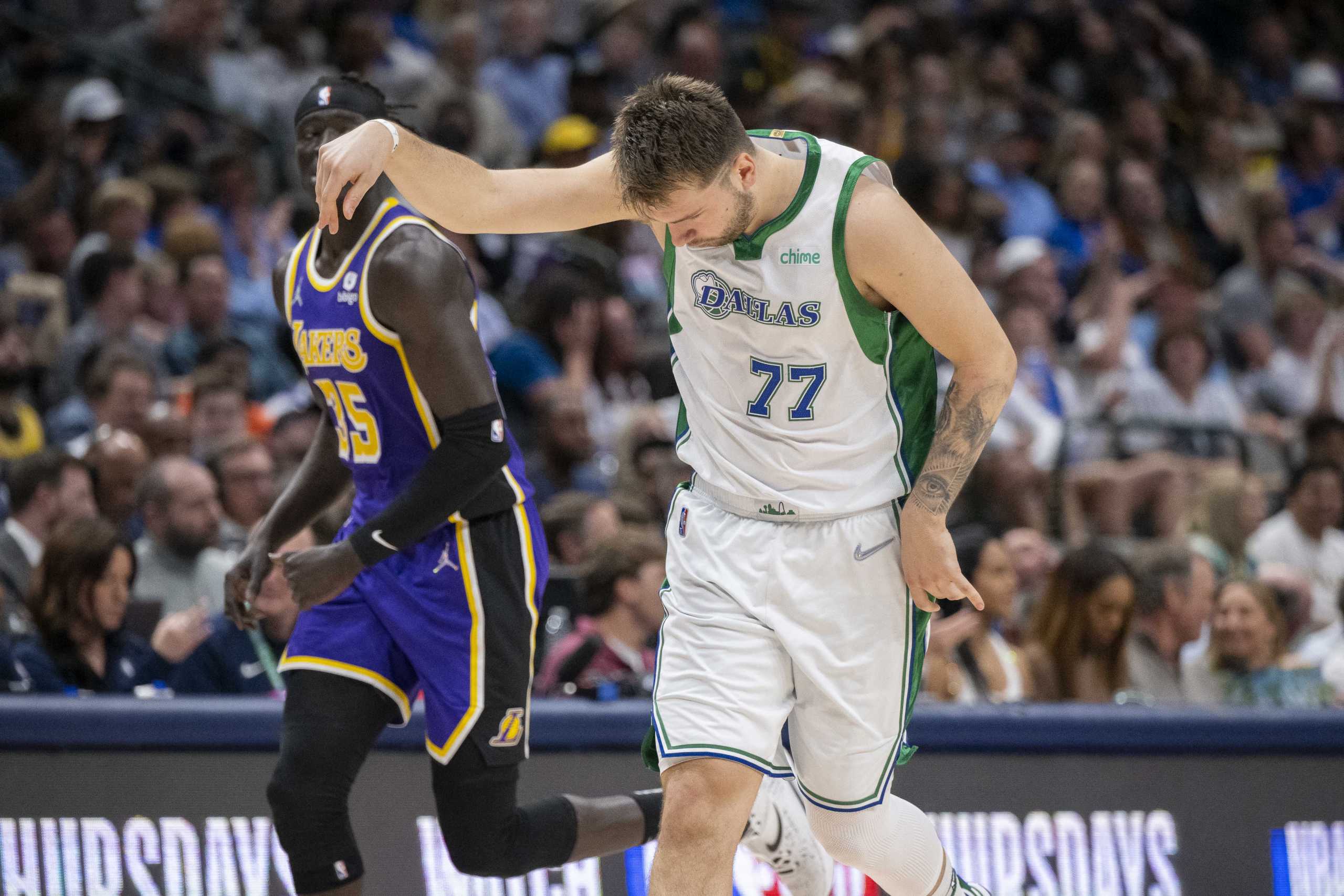 Mar 29, 2022; Dallas, Texas, USA; Dallas Mavericks guard Luka Doncic (77) celebrates making a three point shot against the Los Angeles Lakers during the second half at the American Airlines Center. Mandatory Credit: Jerome Miron-USA TODAY Sports