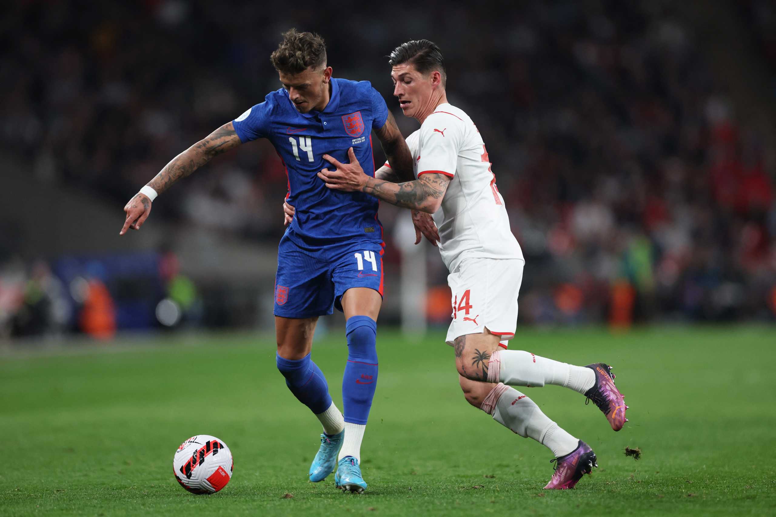 Soccer Football - International Friendly - England v Switzerland - Wembley Stadium, London, Britain - March 26, 2022 England's Ben White in action with Switzerland's Steven Zuber Action Images via Reuters