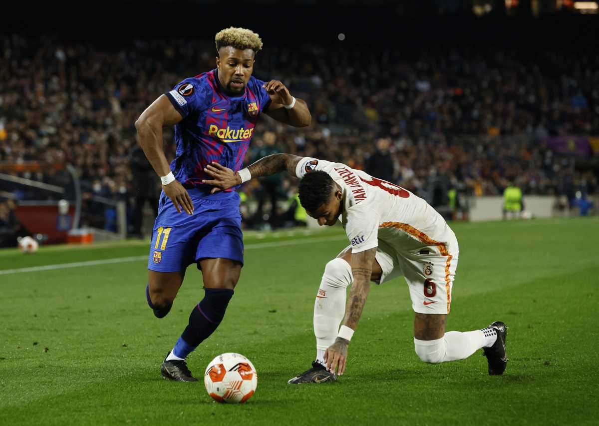 Soccer Football - Europa League - Round of 16 First Leg - FC Barcelona v Galatasaray - Camp Nou, Barcelona, Spain - March 10, 2022 FC Barcelona's Adama Traore in action with Galatasaray's Patrick van Aanholt REUTERS