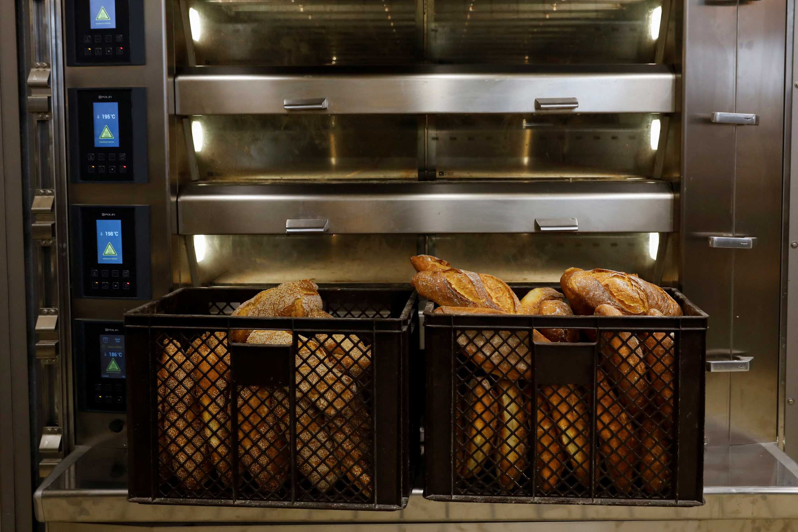 Breads are kept in front an oven, at a bakery in Athens, Greece, March 17, 2022. REUTERS