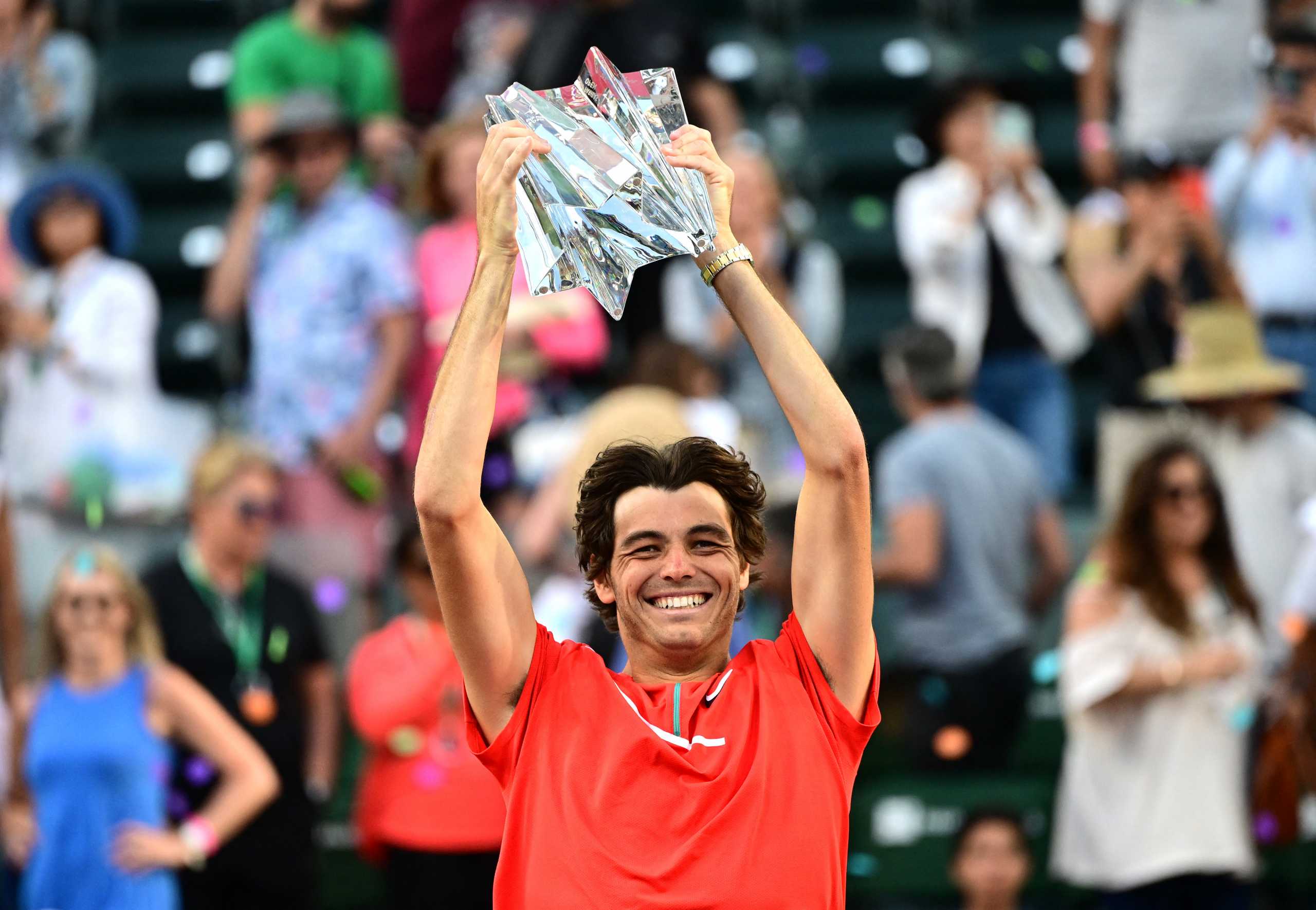 Mar 20, 2022; Indian Wells, CA, USA;   Taylor Fritz (USA) holds the championship trophy after defeating Rafael Nadal (ESP) in the men’s final at the Indian Wells Tennis Garden. Mandatory Credit: Jayne Kamin-Oncea-USA TODAY Sports
