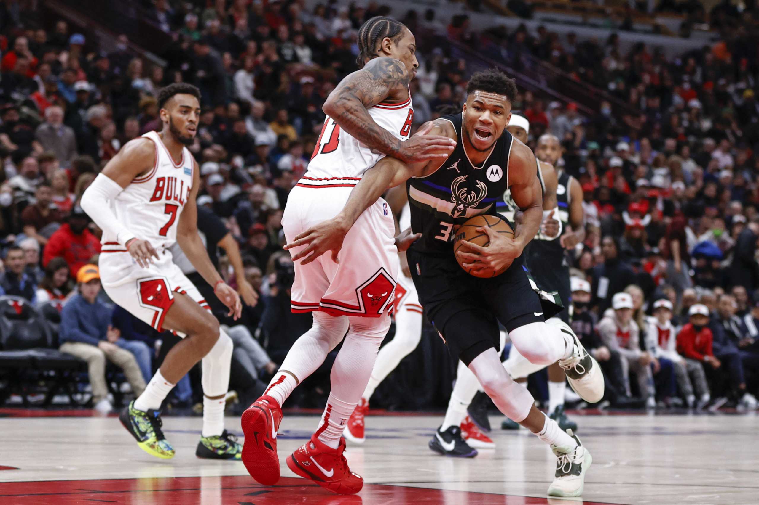 Mar 4, 2022; Chicago, Illinois, USA; Chicago Bulls forward DeMar DeRozan (11) defends against Milwaukee Bucks forward Giannis Antetokounmpo (34) during the first half at United Center. Mandatory Credit: Kamil Krzaczynski-USA TODAY Sports
