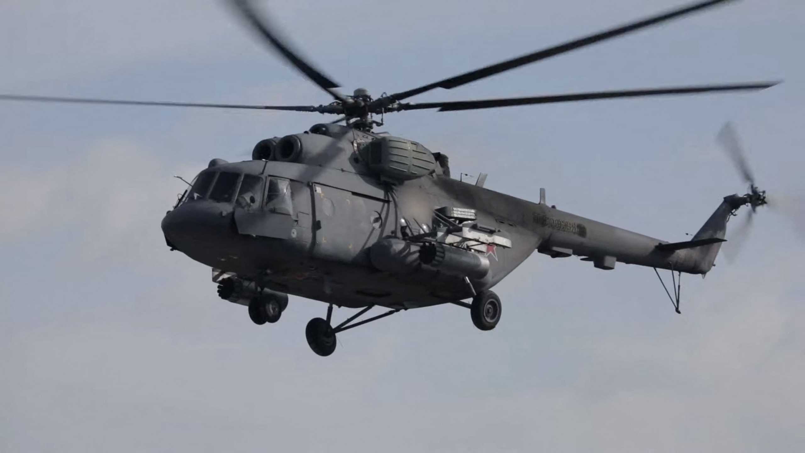 Russian Army aviation helicopters escort units of Russian Armed Forces in Ukraine, during their invasion, at in unspecified location in this screengrab obtained from social media, March 2, 2022. Russian Defence Ministry