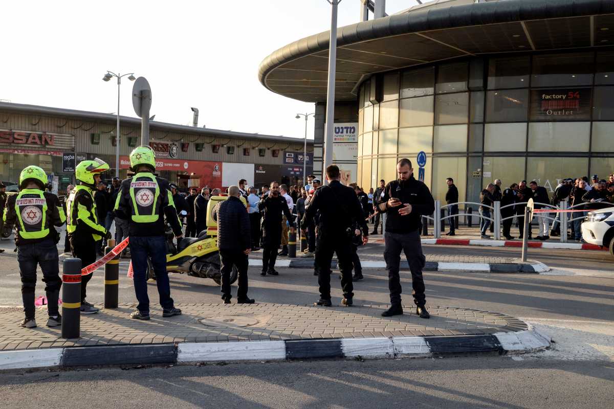 Israeli security and rescue forces secure the scene of an attack in which people were killed near a shopping centre in Beersheba, Israel, March 22, 2022. REUTERS