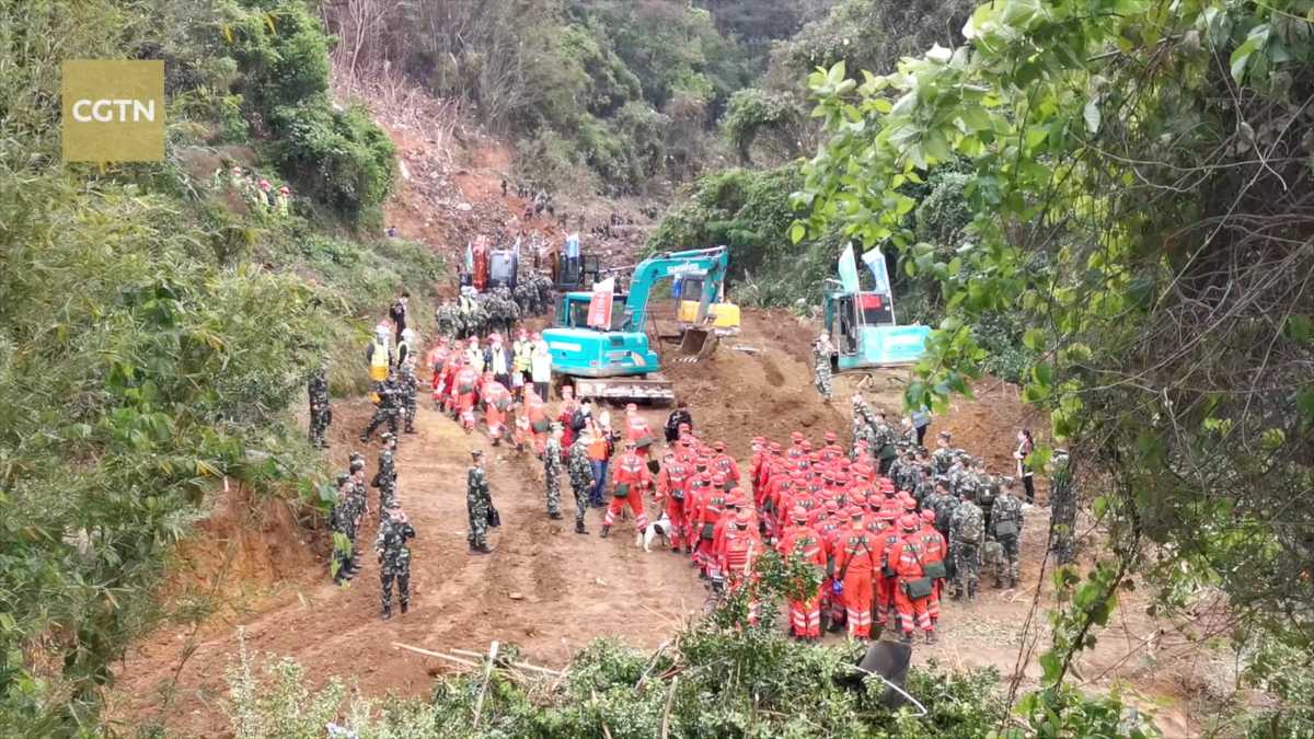 Rescuers work at the site where a China Eastern Airlines Boeing 737-800 plane, flight MU5735, crashed in Wuzhou, Guangxi Zhuang Autonomous Region, China, in this still image taken from a footage March 22, 2022. Video taken March 22, 2022. CGTN via REUTERS TV  ATTENTION EDITORS - THIS IMAGE WAS PROVIDED BY A THIRD PARTY. NO RESALES. NO ARCHIVES. CHINA OUT.