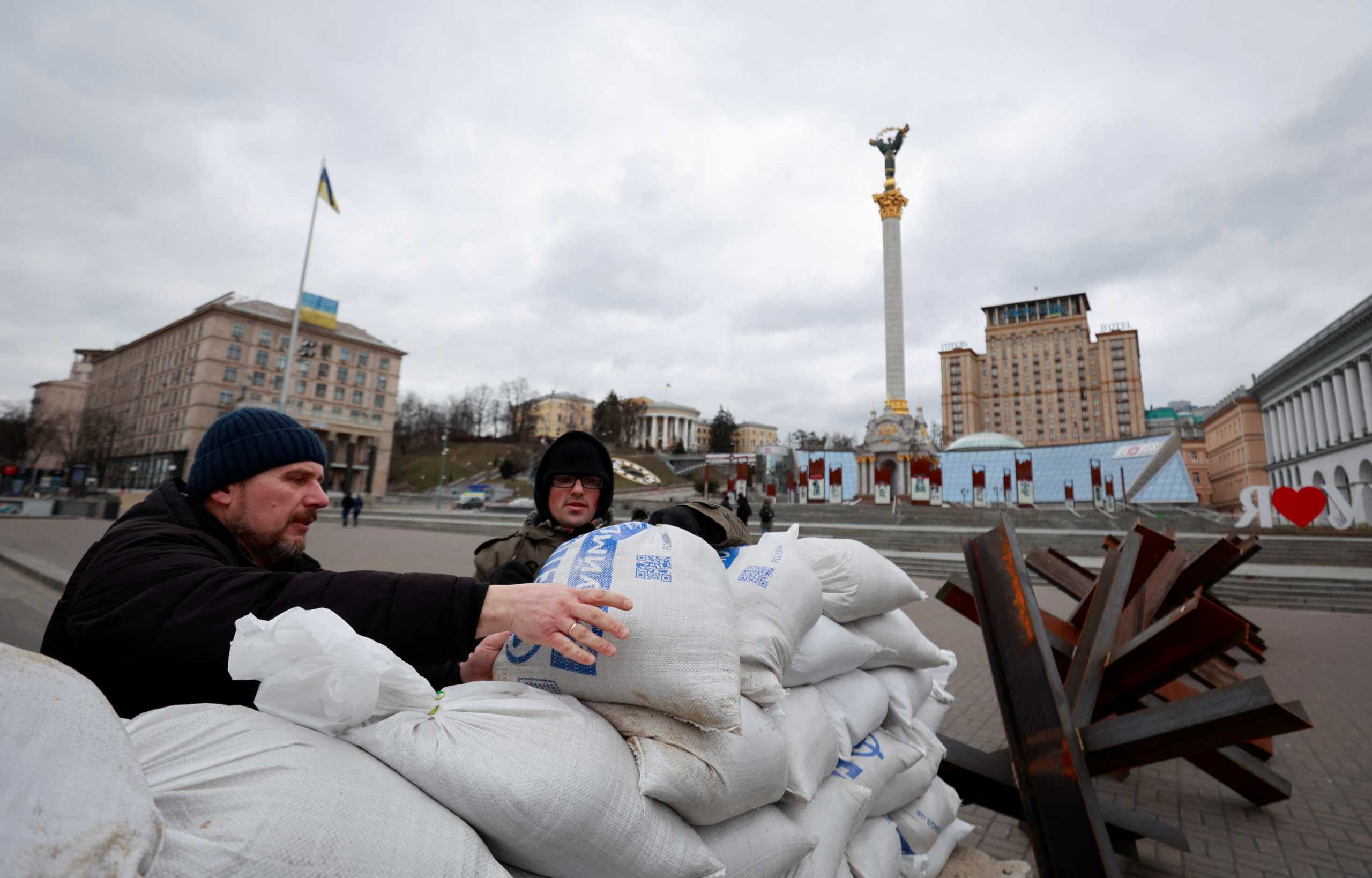 People place bags with sand while erecting a checkpoint during Ukraine-Russia conflict in Independence Square in central Kyiv, Ukraine March 5, 2022. REUTERS