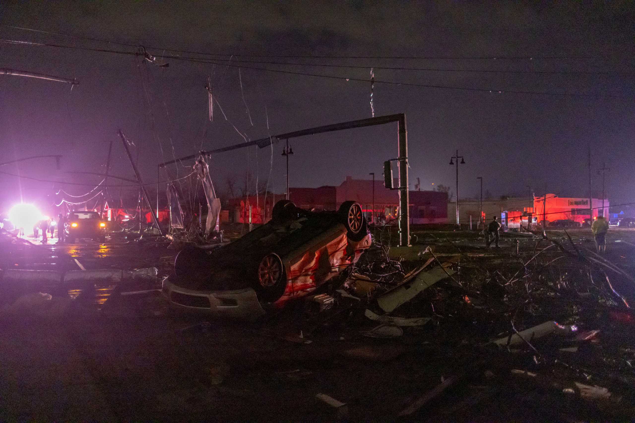 A car lies overturned amid debris after a tornado struck in the Arabi neighborhood, St. Bernard Parish, New Orleans, Louisiana March 22, 2022. REUTERS