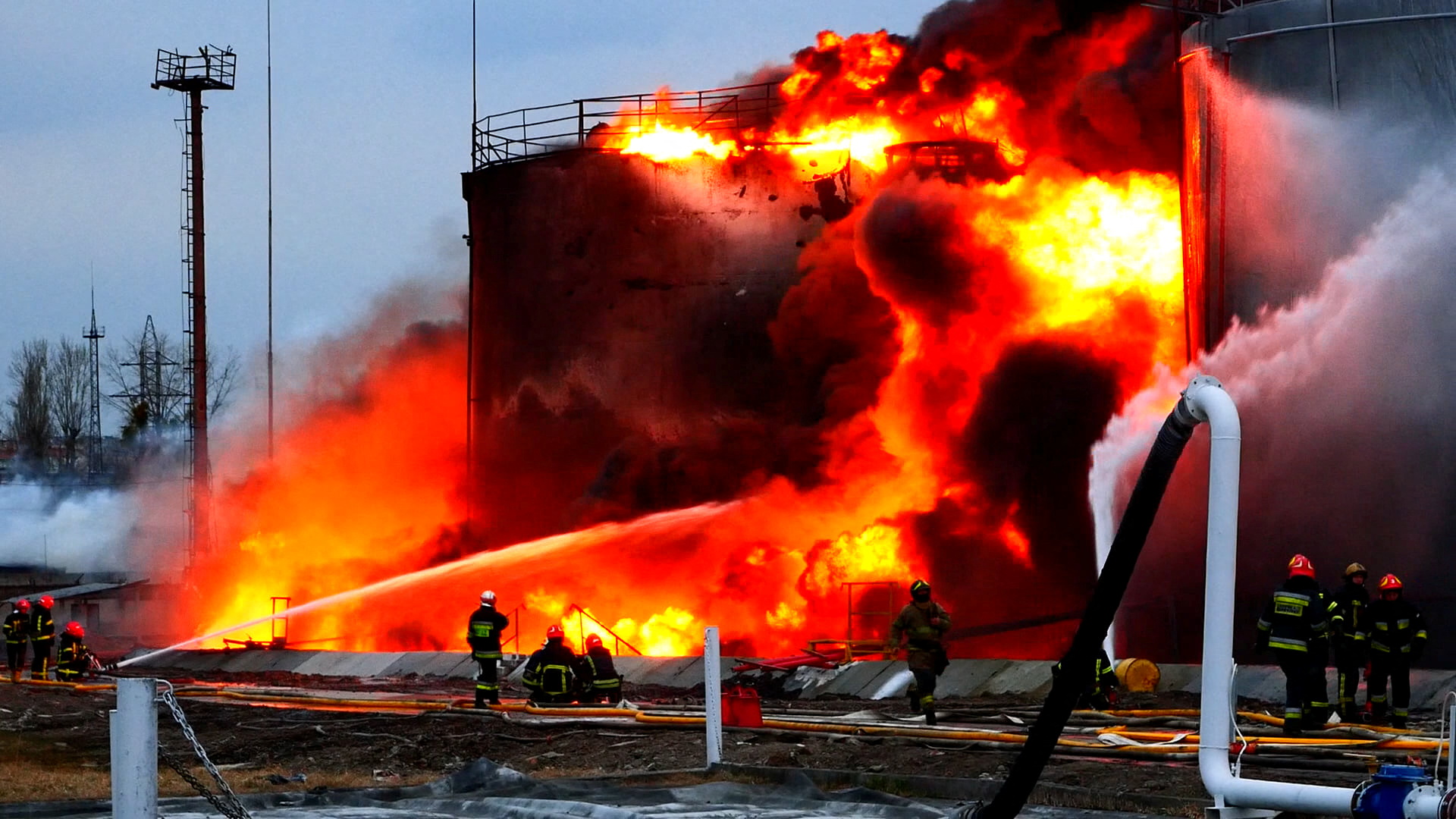 Rescuers work at a site of fuel storage facilities hit by cruise missiles, as Russia's attack on Ukraine continues, in Lviv, in this handout picture released March 27, 2022.  Press service of the State Emergency Service of Ukraine