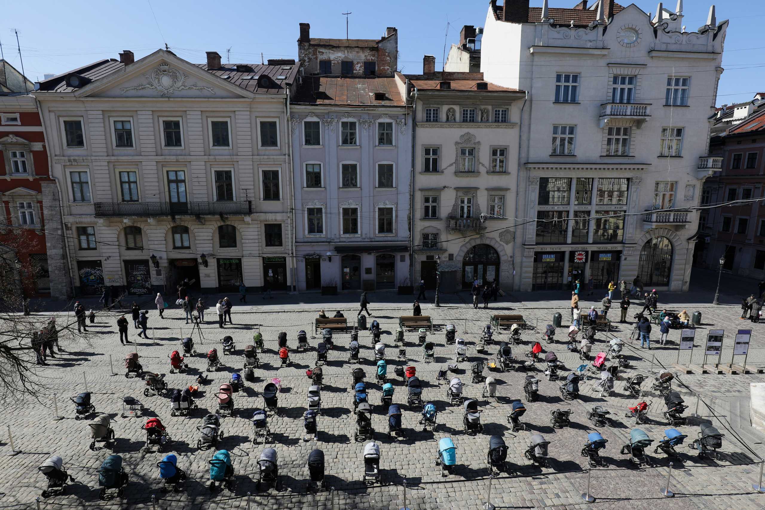 A general view of 109 empty prams placed in the center of Lviv during the "Price of War" campaign organized by local activists and authorities to highlight the large number of children killed in ongoing Russia's invasion of Ukraine, in Lviv, March 18, 2022. REUTERS