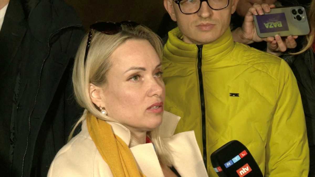 Marina Ovsyannikova, a Channel One employee who staged an on-air protest as she held up a anti-war sign behind a studio presenter, speaks to the media as the leaves the court building in Moscow, Russia March 15, 2022 in this still image taken from a video. REUTERS TV via REUTERS