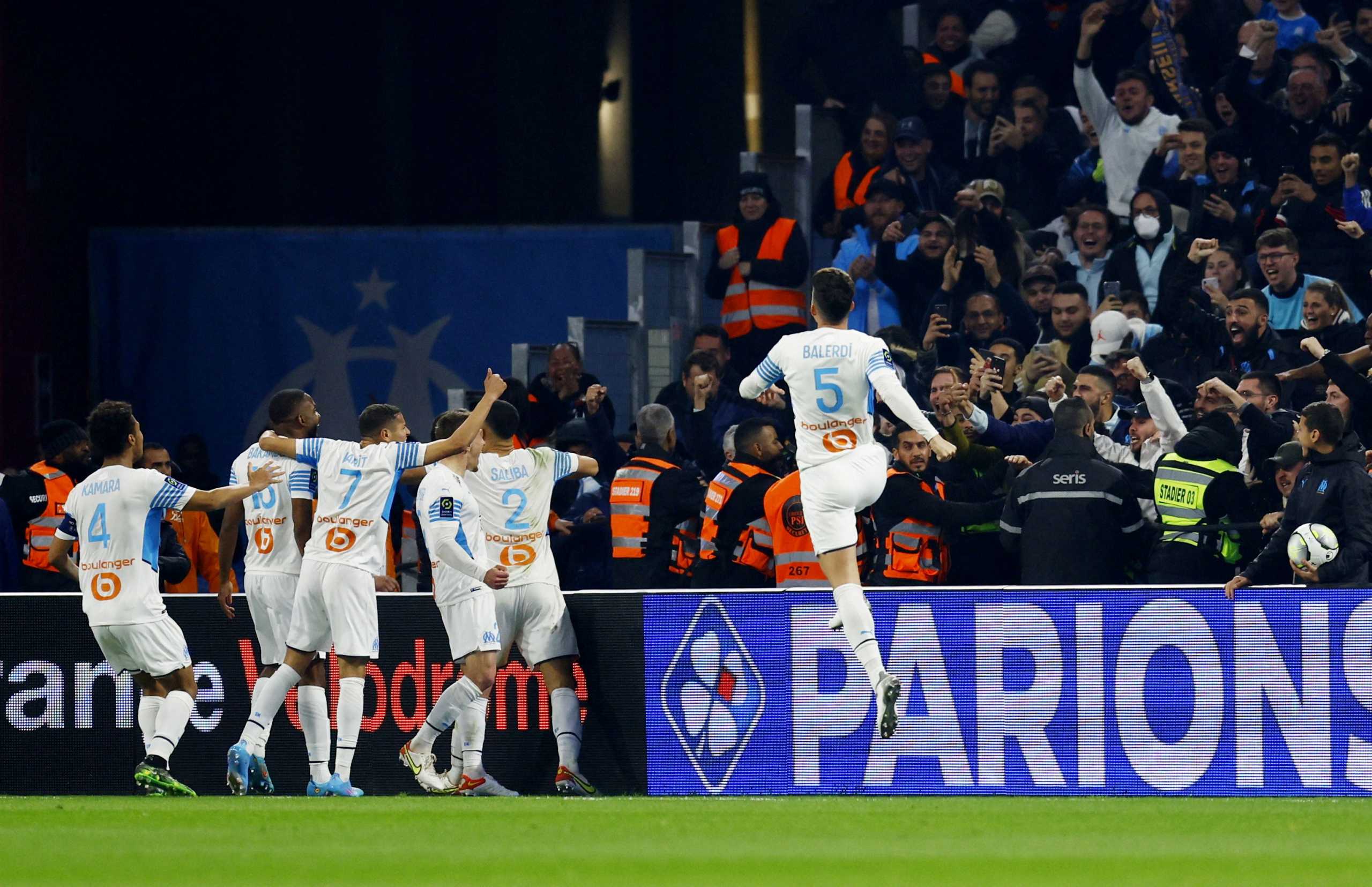 Soccer Football - Ligue 1 - Olympique de Marseille v OGC Nice - Orange Velodrome, Marseille, France - March 20, 2022 Olympique de Marseille's Cedric Bakambu celebrates scoring their second goal with teammates REUTERS