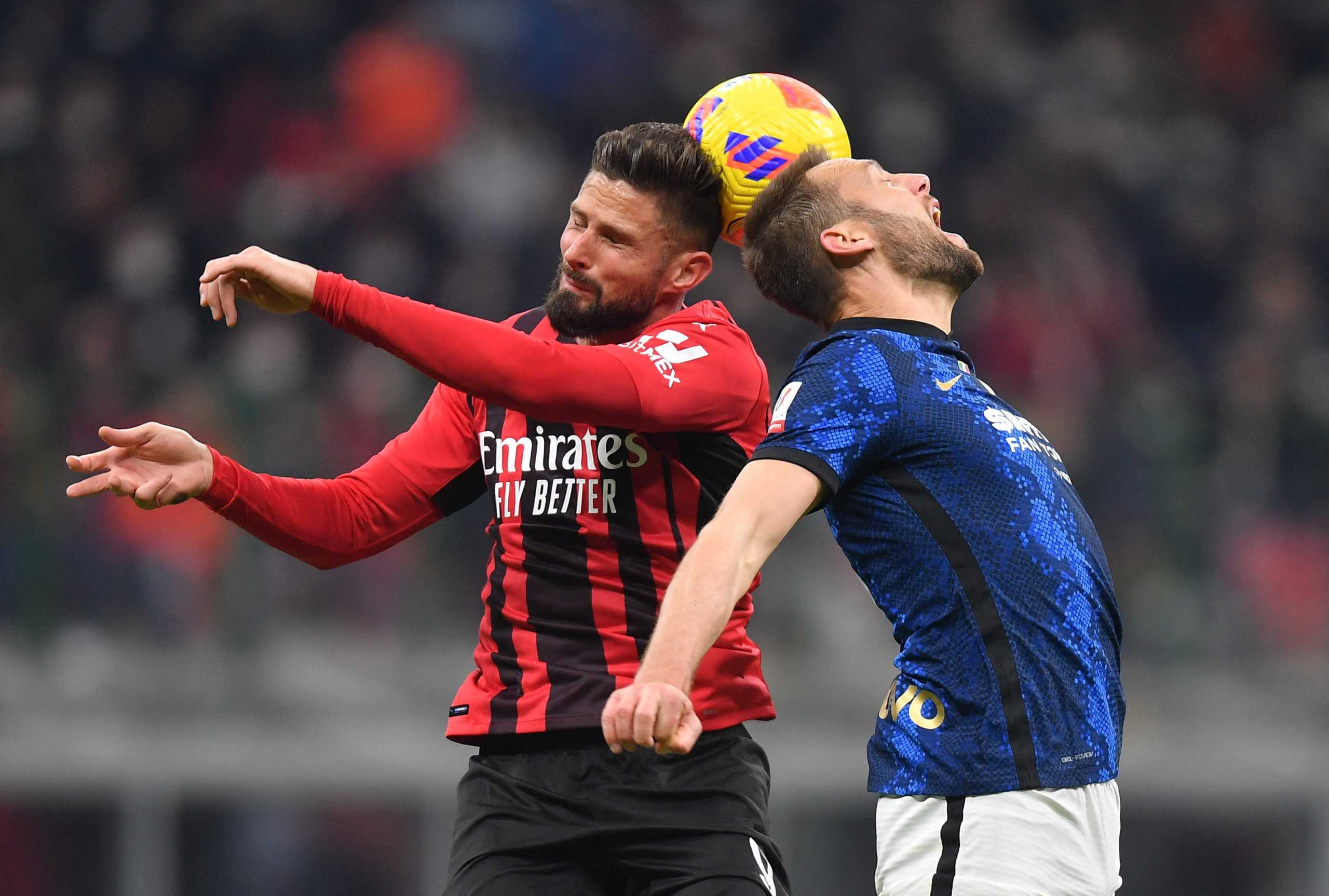 Soccer Football - Coppa Italia - Semi Final First Leg - AC Milan v Inter Milan - San Siro, Milan, Italy - March 1, 2022 AC Milan's Olivier Giroud in action with Inter Milan's Stefan de Vrij REUTERS