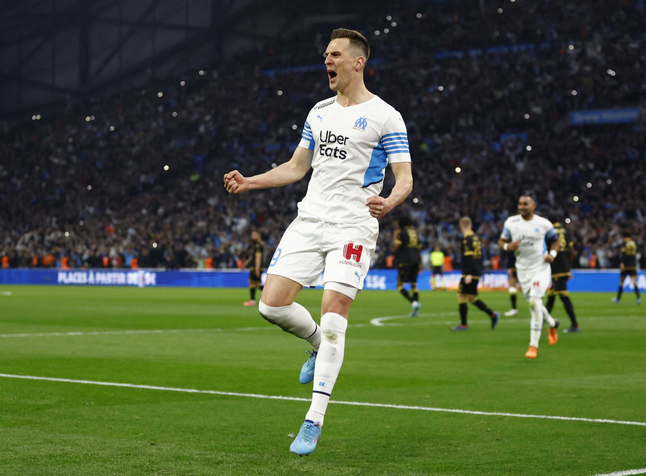 Soccer Football - Ligue 1 - Olympique de Marseille v OGC Nice - Orange Velodrome, Marseille, France - March 20, 2022 Olympique de Marseille's Arkadiusz Milik celebrates scoring their first goal REUTERS